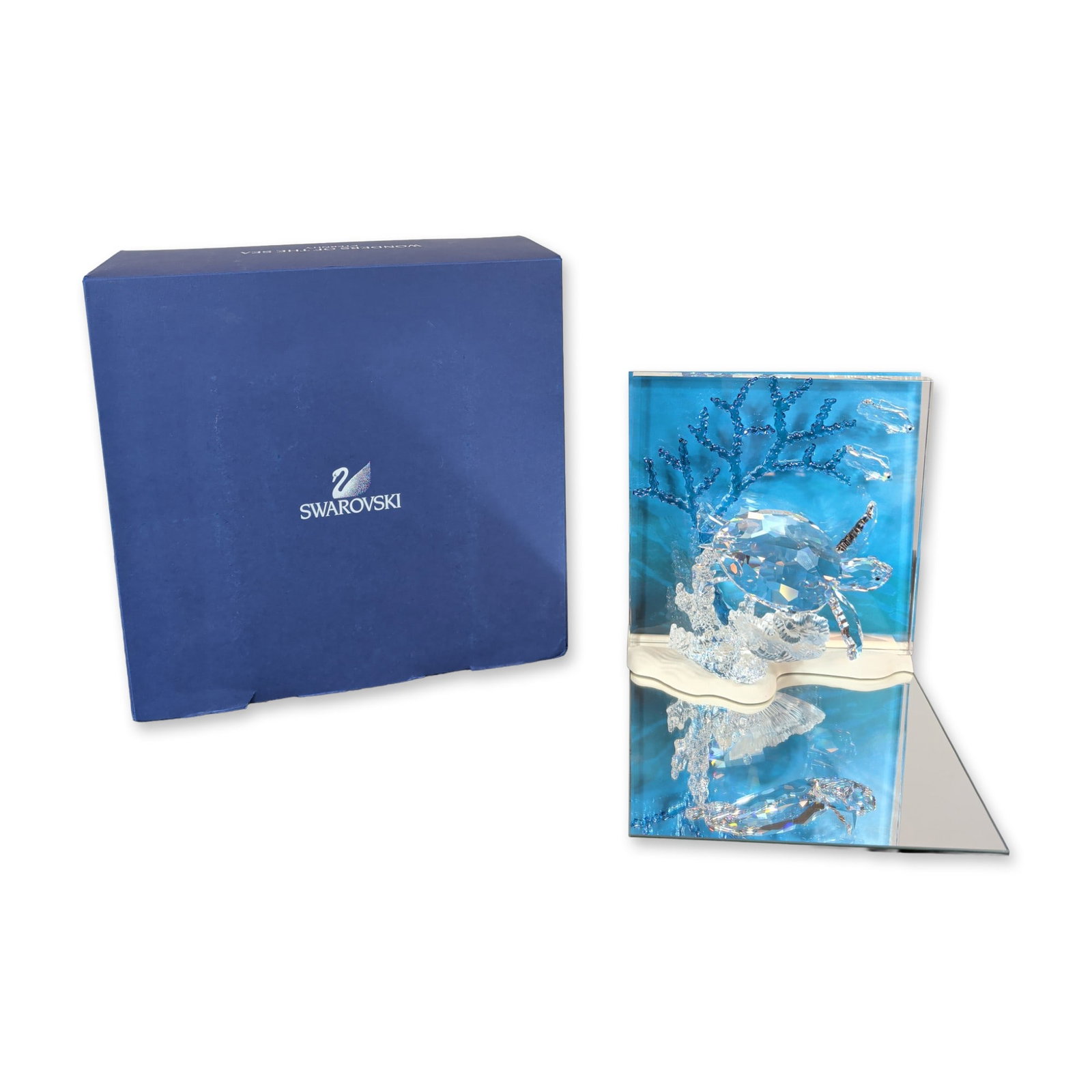 Swarovski Crystal Eternity Sea Turtle Sculpture: Swarovski faceted lead crystal sculpture titled Eternity, part of the Wonders of the Sea collection designed by Michael Stamey. The piece features a central sea turtle and two small fish swimming amon