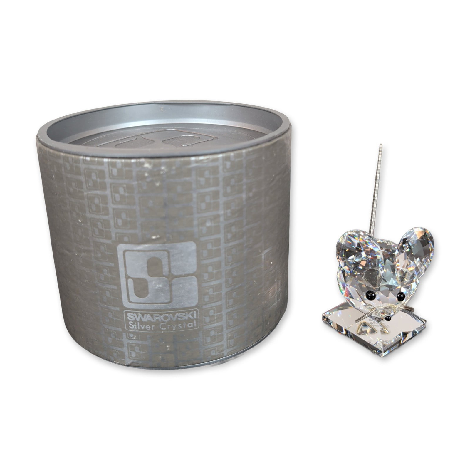 Swarovski Silver Crystal Figurine, Medium Mouse: The figure features large circular faceted ears, two black bead eyes, and a flexible coiled metal tail. The base is etched with the Swarovski swan logo and brand name. Accompanied by the original bran