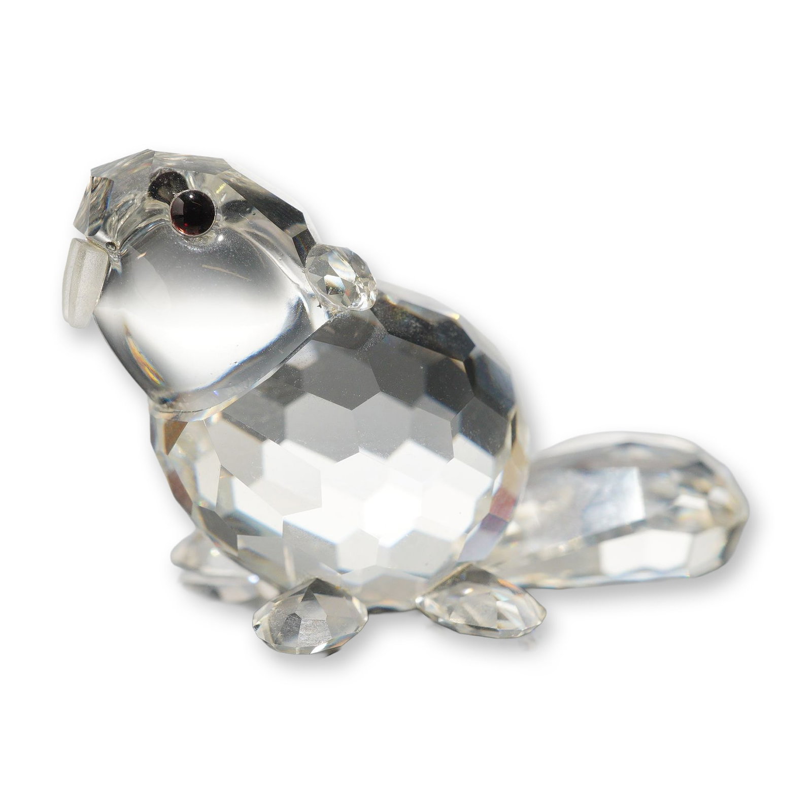 Swarovski Silver Crystal Sitting Beaver Figurine: Swarovski Silver Crystal. Figurine depicting a sitting beaver in clear faceted lead crystal, featuring a broad flat tail and two small dark bead eyes. Marked with an acid-etched Swarovski swan logo on