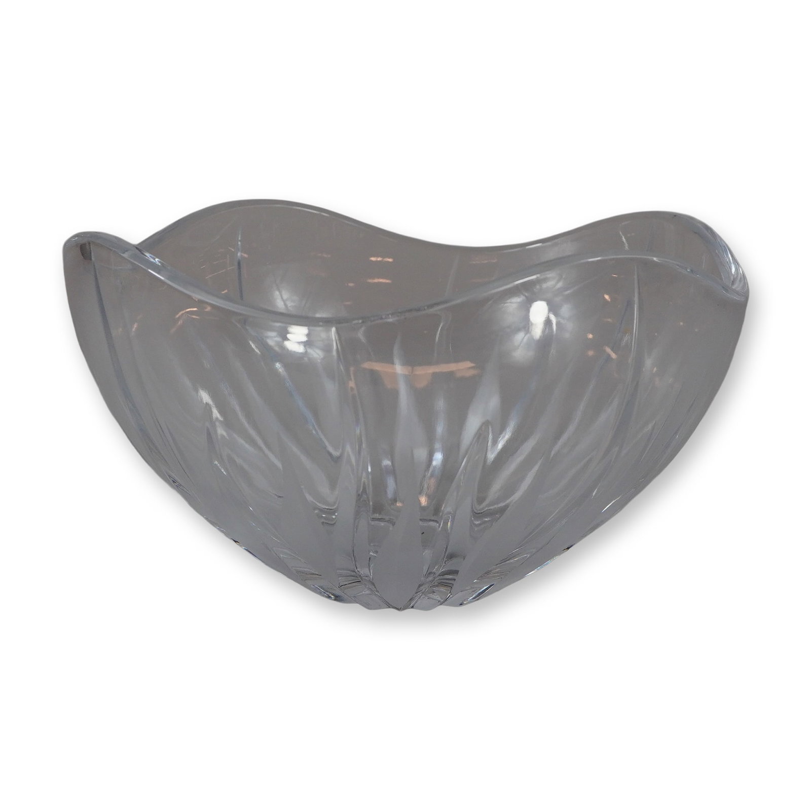 Lead Crystal Centerpiece Bowl with Radiating Petal Design and Frosted Accents: This lead crystal centerpiece bowl features a modern form with an undulating rim and thick-walled construction. The exterior is decorated with a petal-like design with a radiating rib design and frost