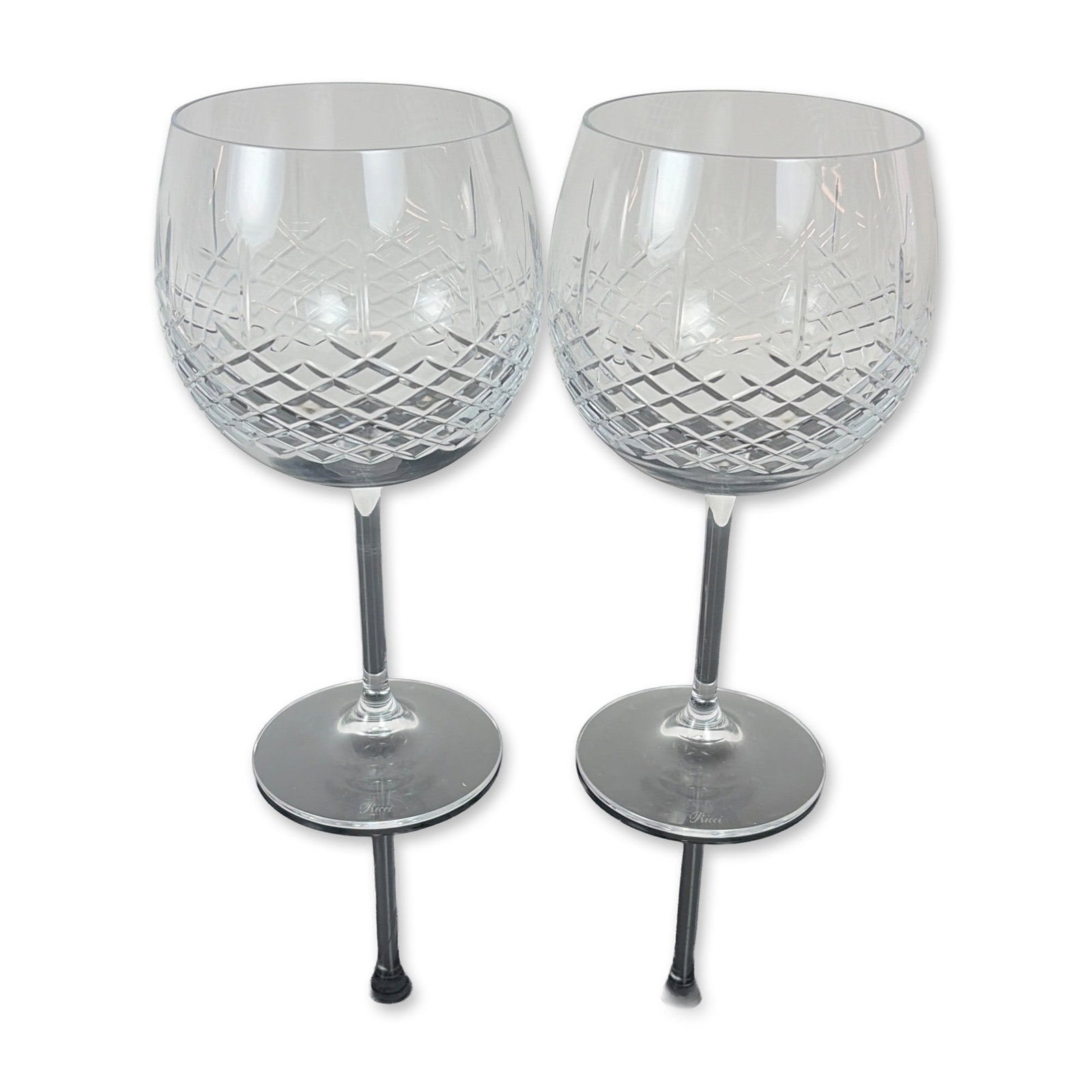 Pair of Ricci Cut Crystal Balloon Wine Glasses: Set of Ricci Argentieri cut crystal wine glasses. Each glass features a globular bowl decorated with a precision diamond cut pattern to the lower half, transitioning to a clear upper section. The bowl