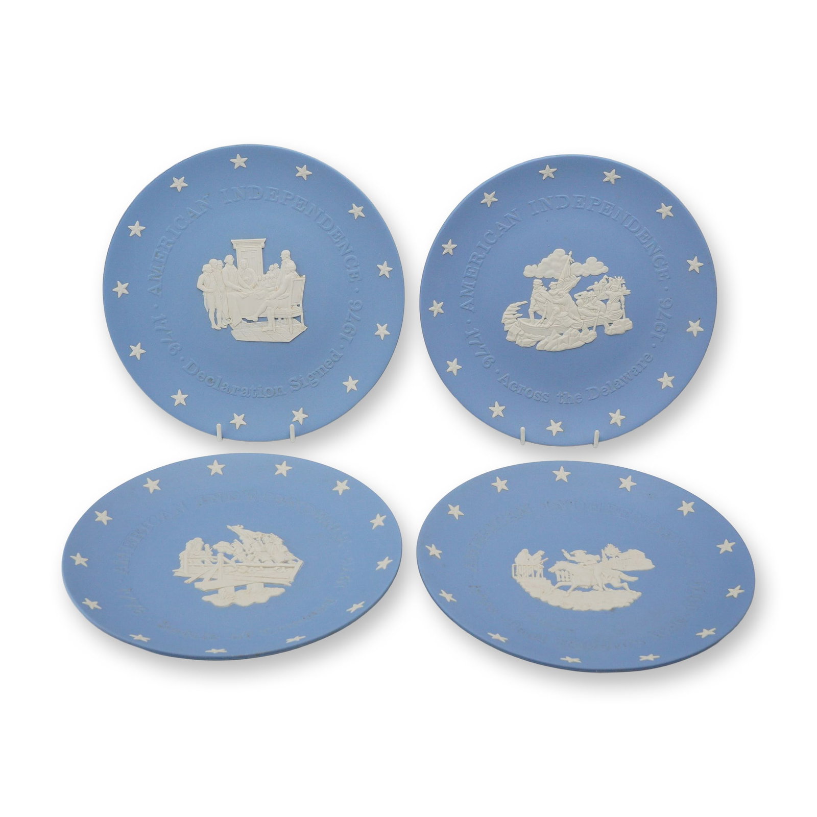 Set of 4 Wedgwood Blue Jasperware American Independence Bicentennial Commemorative Plates: This set of 4 commemorative plates is crafted from pale blue Jasperware, a matte, unglazed stoneware produced by the Wedgwood factory in England. The series was issued to commemorate the American Inde