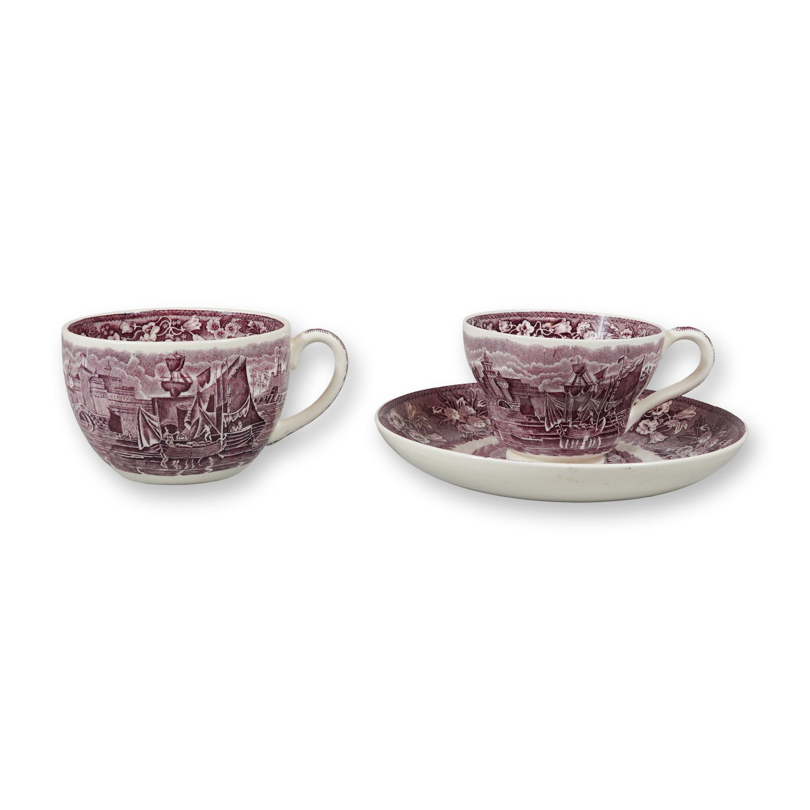 A Trio of Wedgwood Ferrara Mulberry Earthenware Cups and Saucer: This lot consists of three earthenware pieces in the Ferrara pattern by Wedgwood. The group includes one large breakfast cup, one standard teacup, and one matching saucer. Each piece features a mulber