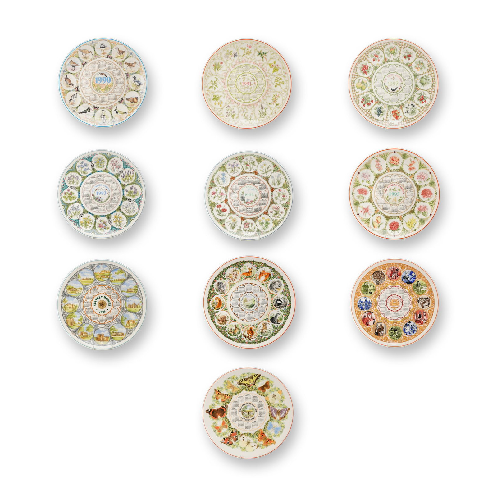 10pc Wedgwood Queen's Ware Calendar Plates, 1990-1999: This collection consists of ten Wedgwood decorative ceramic calendar plates produced in England between 1990 and 1999. Manufactured from Queen's Ware, each plate features a central circular calendar f