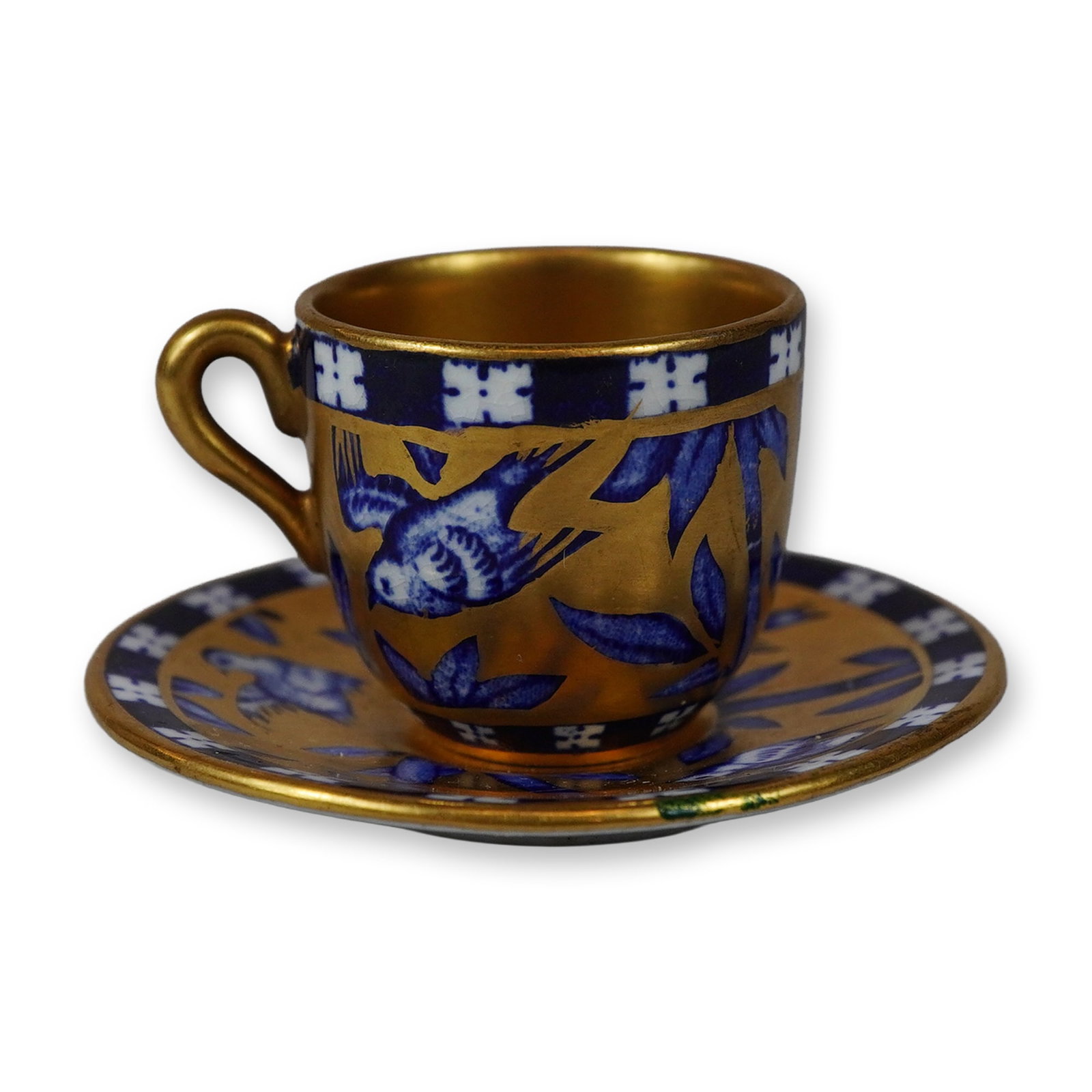 2pc Coalport Miniature Porcelain Chinoiserie Child's Cup and Saucer: A miniature porcelain cup and saucer set produced by the Coalport Porcelain Works of Shropshire, England. This child's set features a vibrant Chinoiserie pattern depicting blue birds in flight and bam