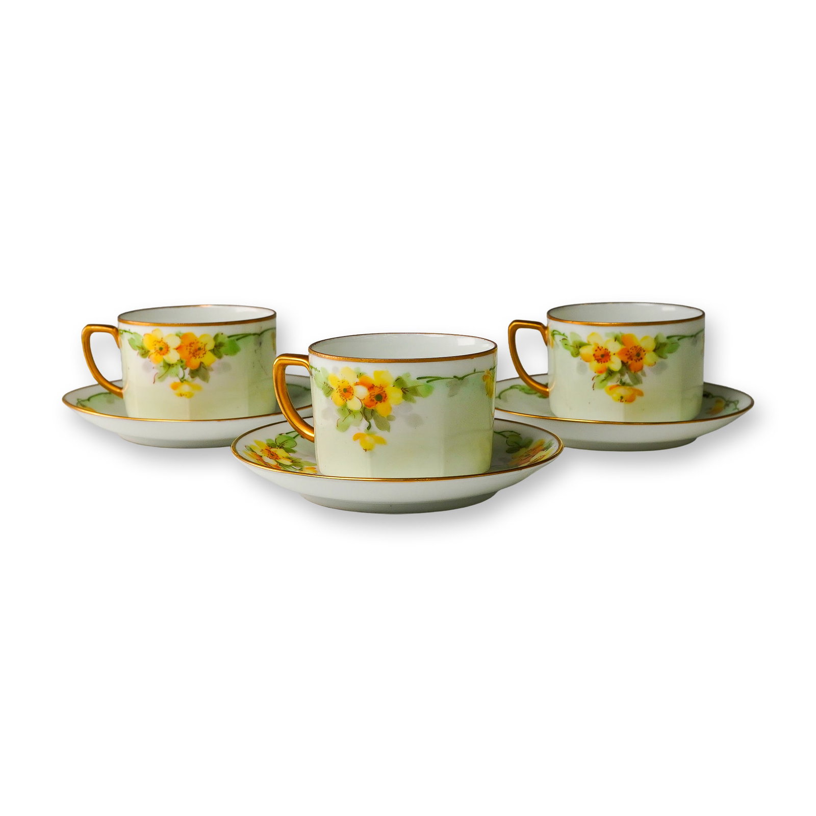 6pc Hand-Painted Yellow Floral Porcelain Cup & Saucer Trio, Austria: A charming 6-piece porcelain demitasse cups (3) and matching saucers (3), each delicately hand-painted with yellow and orange blossoms, leafy green garlands, and highlighted with gilt detailing. The c