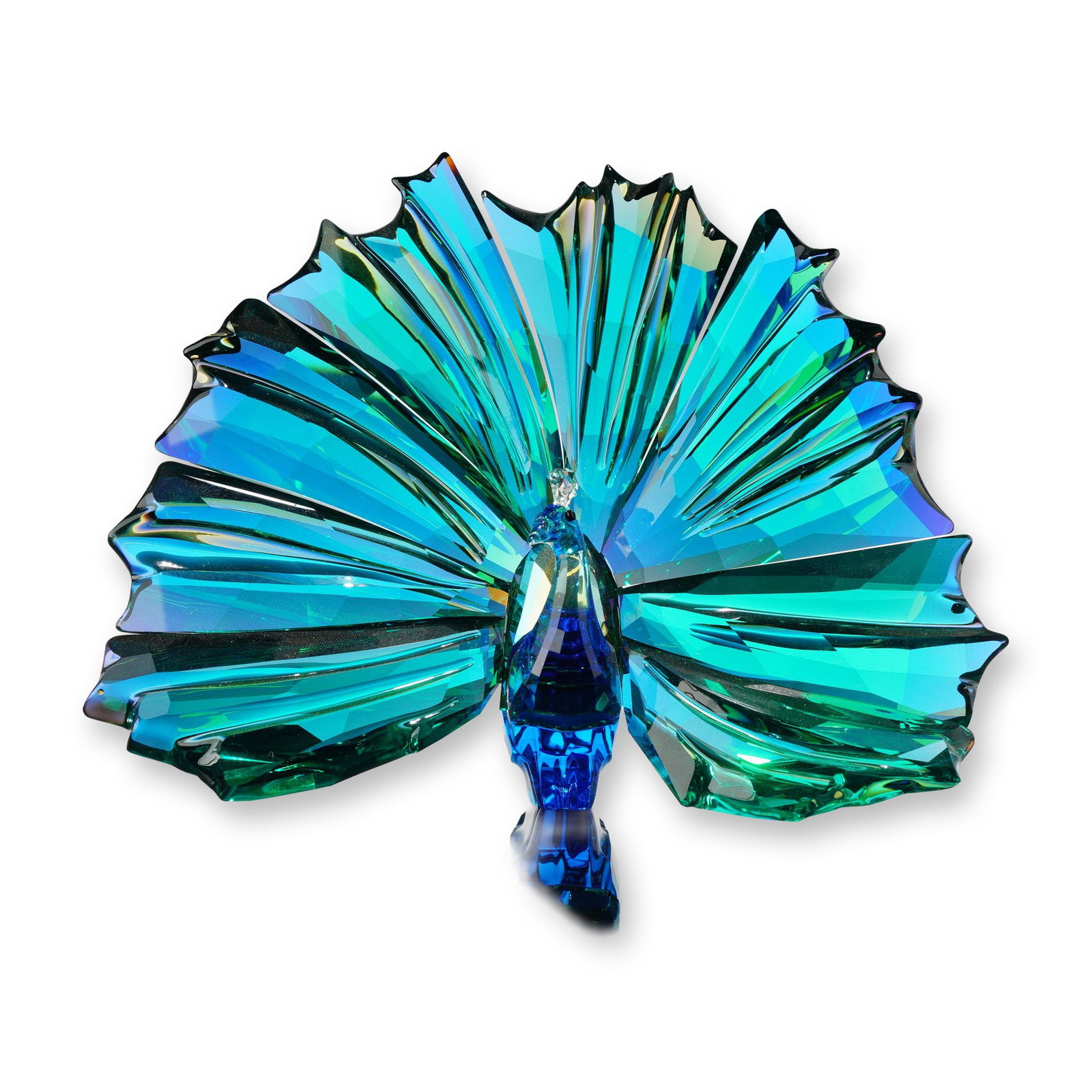Swarovski 2015 SCS Annual Edition Crystal Figurine, Arya Peacock: Swarovski Crystal Society (SCS) 2015 Annual Edition peacock figurine titled Arya. The piece is crafted in multifaceted colored crystal, featuring a cobalt blue body and a fanned tail transitioning thr