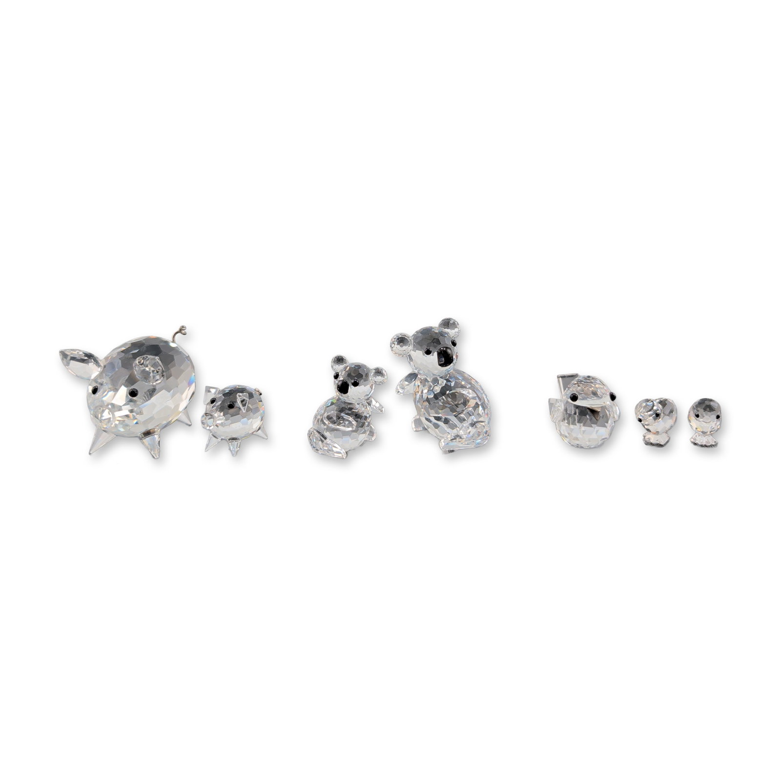Group of 7 Swarovski Silver Crystal Animal Figurines: Swarovski Austrian faceted lead crystal figurines from the Silver Crystal collection. The group features clear crystal animal forms in graduating sizes, including bears and pigs, with small black crys