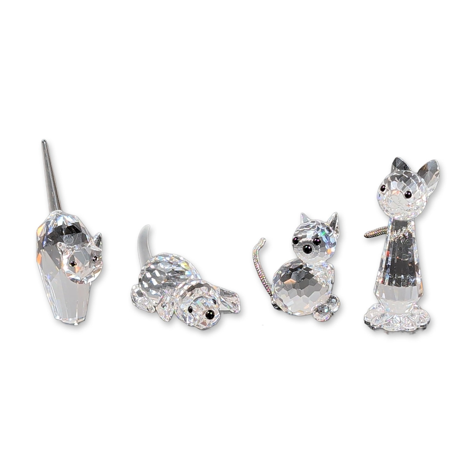 4pc Swarovski Silver Crystal Animal Figurines: Swarovski Silver Crystal. Group of four faceted lead crystal animal figurines featuring three cats in various poses and one dog. The collection includes an elongated cat with a metal collar and tail, 