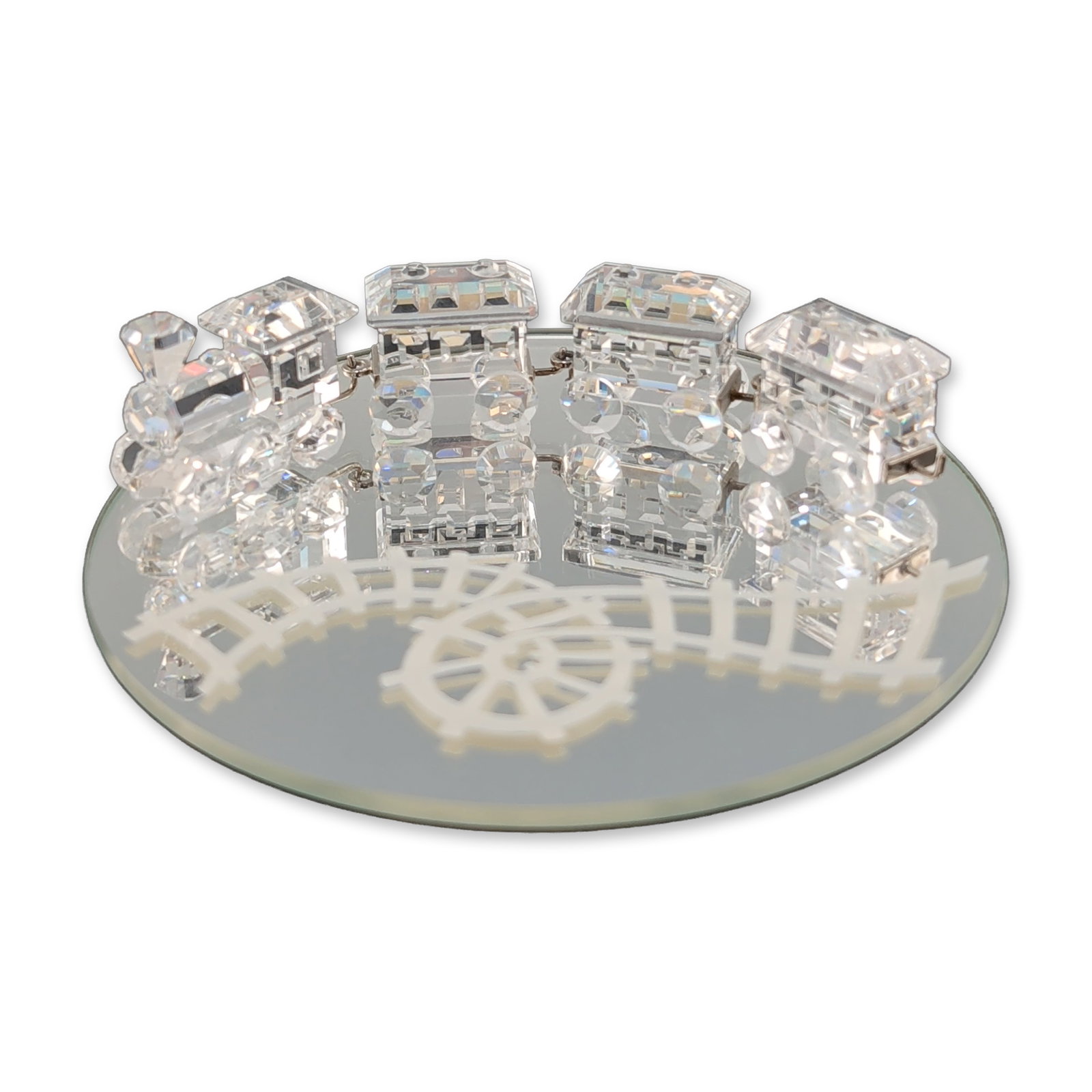 5pc Swarovski Crystal Miniature Train Set with Mirrored Base: Swarovski. Miniature train set in faceted clear crystal, featuring a locomotive and three following cars. Each component is constructed with faceted crystal bodies and wheels joined by silver-tone met