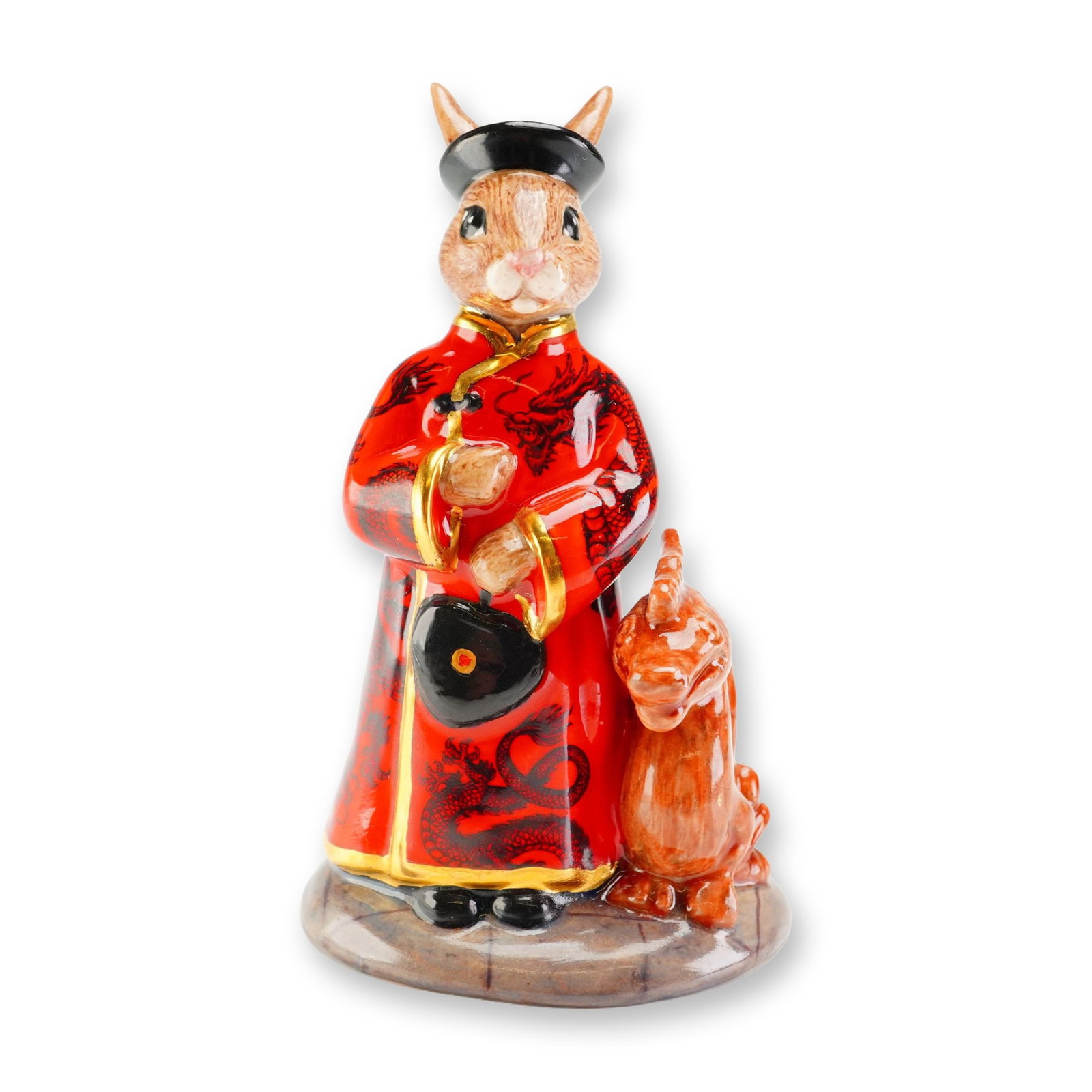 Royal Doulton Prototype Bunnykins Figurine, Mandarin: An exceptional Royal Doulton prototype Bunnykins figurine portraying an aristocratic Chinese rabbit dressed in striking red ceremonial robes richly decorated with an elaborate black dragon motif and h