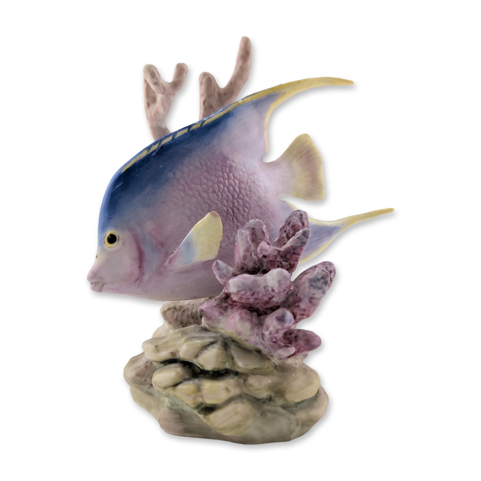 Royal Worcester by Ronald Van Ruyckevelt Bone China Figurine, Blue Angel 3574: The figure depicts an angelfish swimming among pink and buff-colored coral branches. The fish is decorated with a blue dorsal area over a lavender and pink body, featuring pale yellow highlights on th