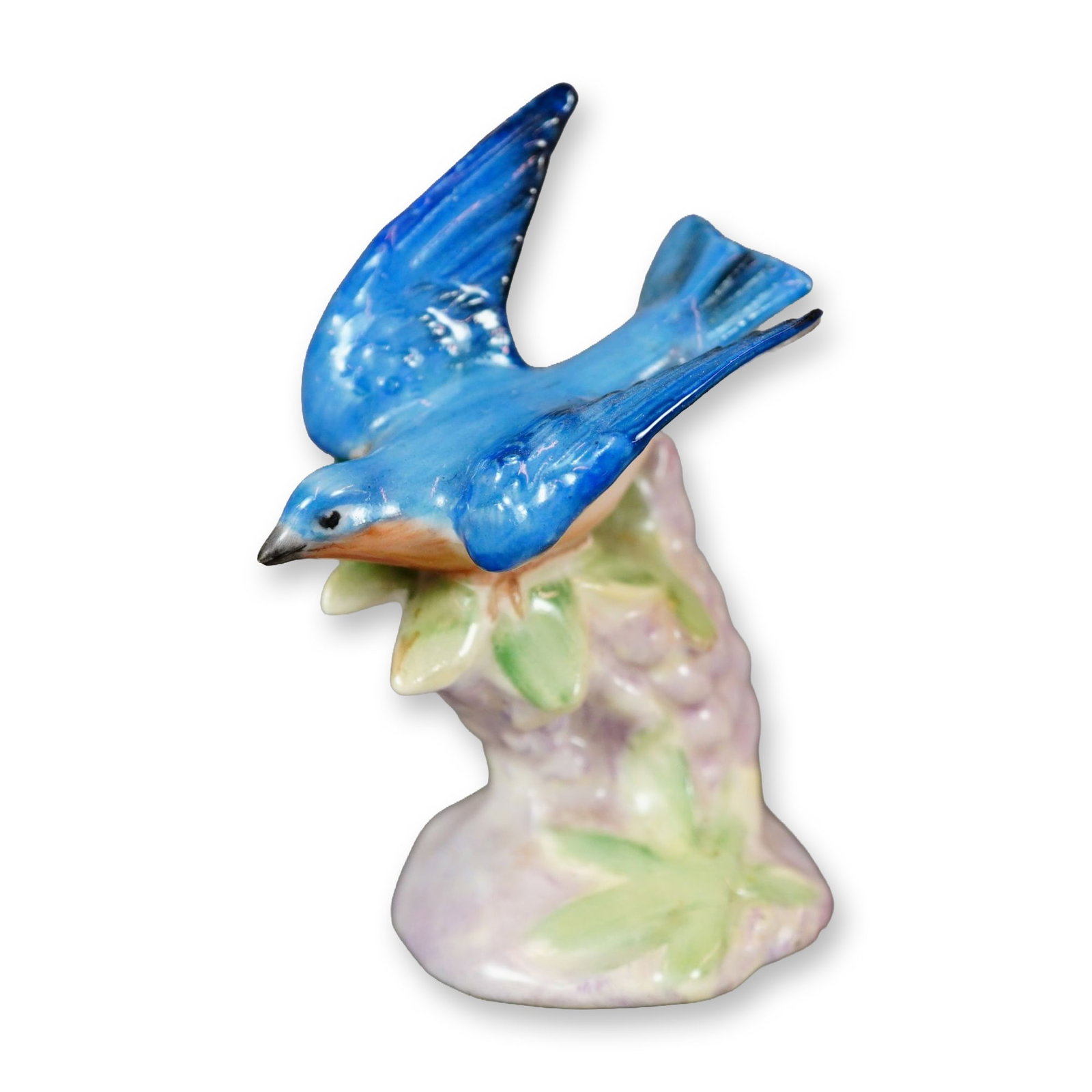 Royal Doulton Porcelain Bird Figurine, Bluebird with Lupins: Hand-painted figure of a bluebird featuring a vibrant orange throat, perched among blooming lupine flowers. Marked with the Royal Doulton backstamp. Dimensions: 1.75"L x 1.5"W x 2.5"H Manufacturer or 