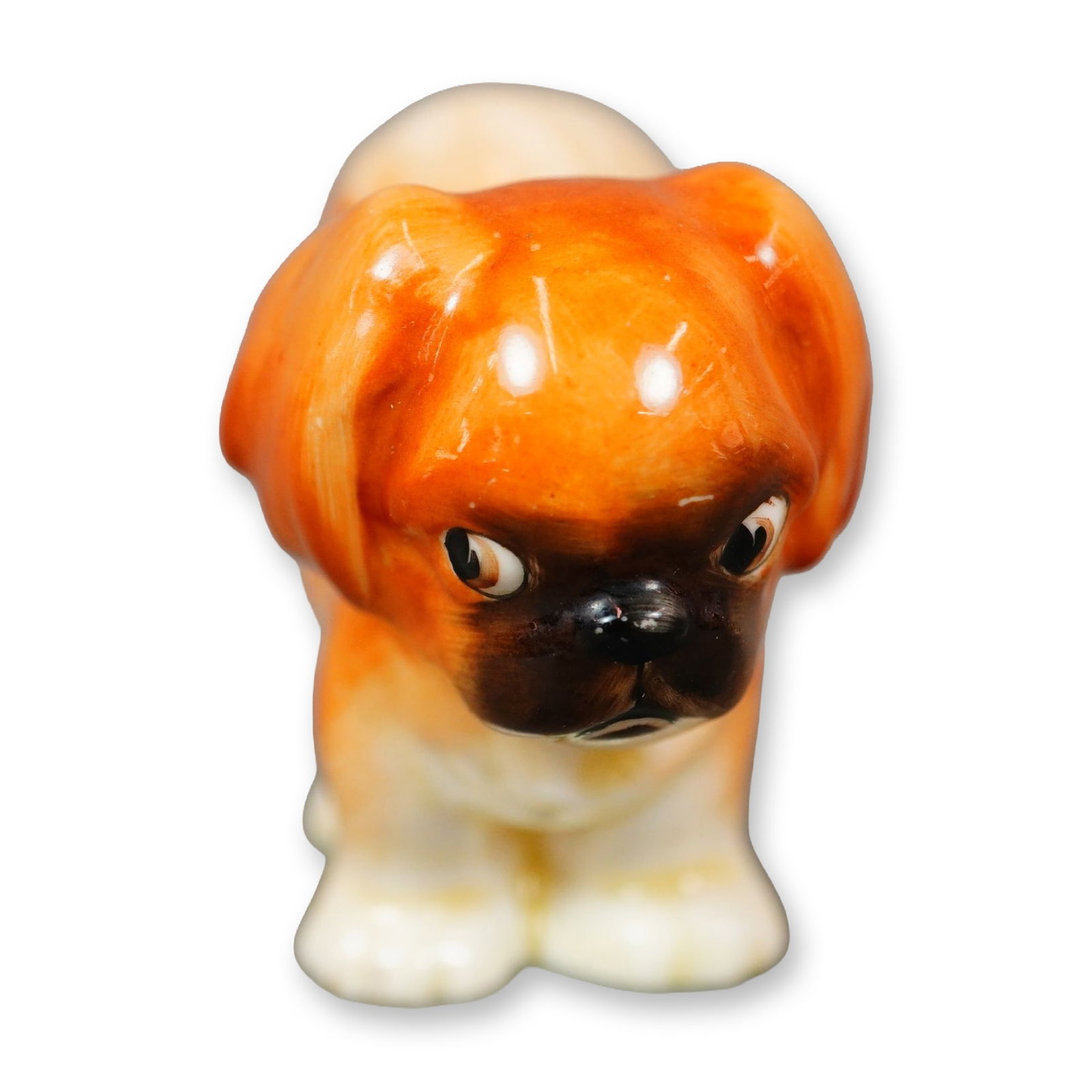 Doulton Porcelain Dog Figurine, Pekinese Puppy HN832: Hand painted figure of a dog standing, in white and brown hues. Doulton backstamp. Dimensions: 2.75"L x 1.5"W x 2"H Manufacturer or Brand: Doulton Weight: 1.5 oz.