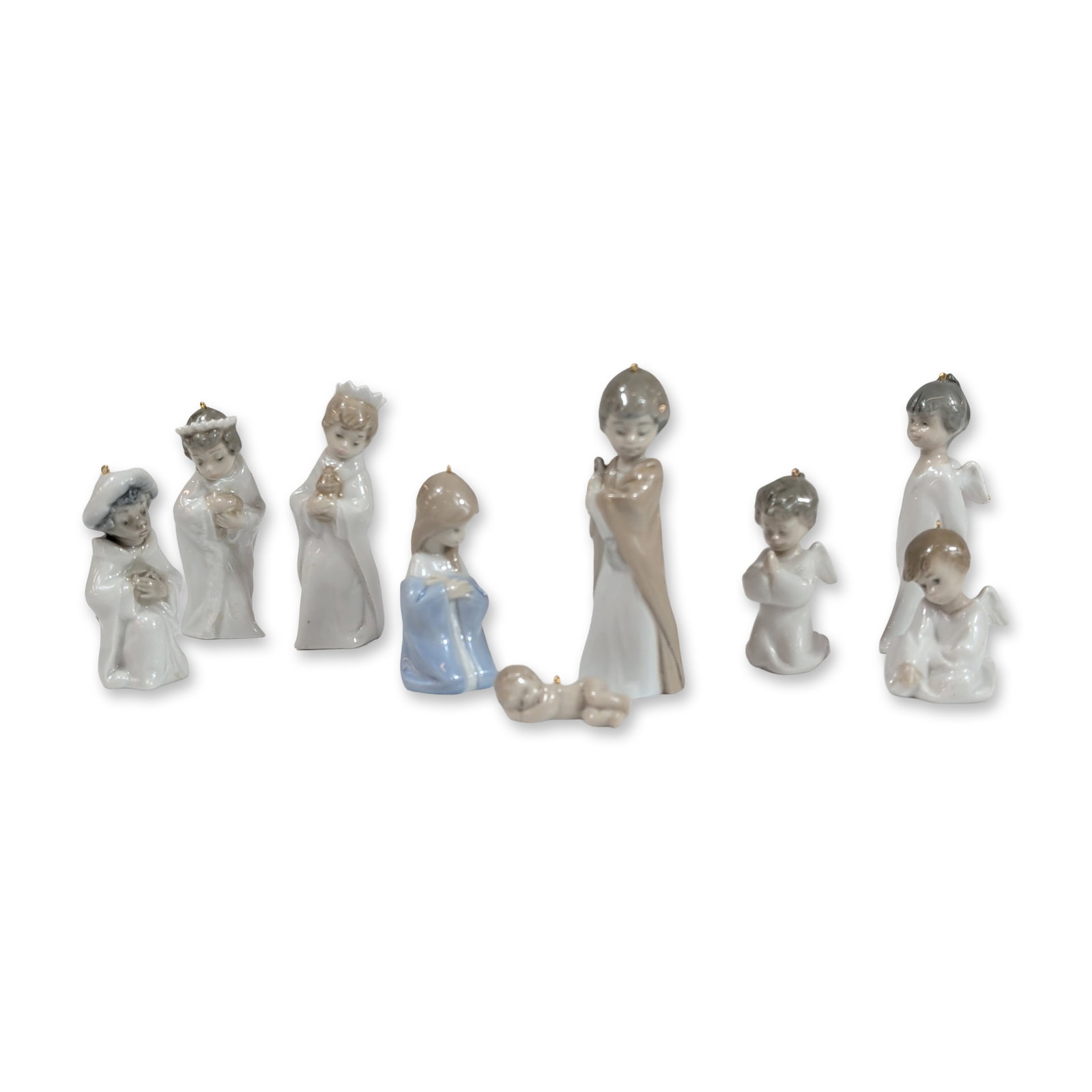 Lladro Spanish Glazed Porcelain Nativity Set: Lladro (Spain). Nativity figurine set from the 1604, 5729, 5657 series in glazed porcelain, featuring stylized figures in a palette of muted blue, gray, and earth tones. The group includes the Holy Fa