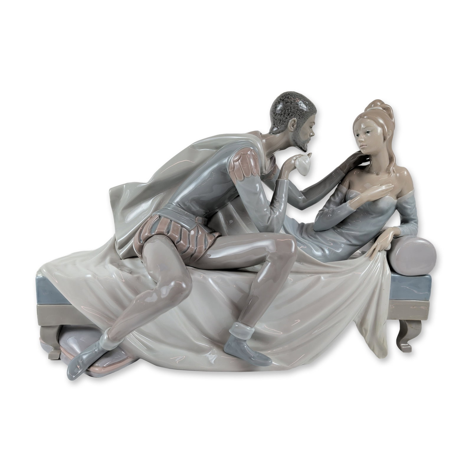 Lladro Spanish Limited Edition Porcelain Othello and Desdemona Sculpture: Lladro Spanish glazed porcelain sculpture titled Othello and Desdemona, model number 1145. The figural group depicts characters from the Shakespearean play in 16th-century Renaissance attire. The male