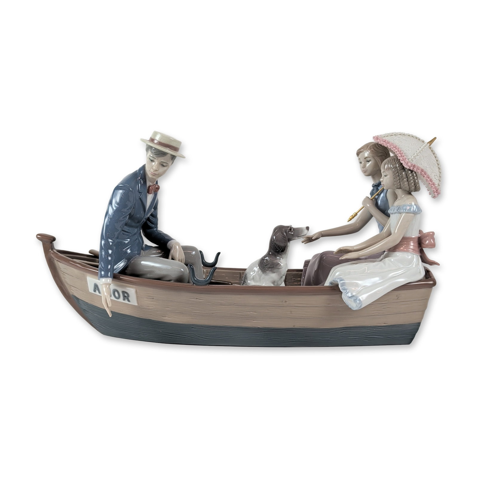 Lladro Porcelain Love Boat Figurine: Lladro (Spanish, 20th century) porcelain figurine group, model number 5354. The polychrome glazed scene depicts a romantic outing in a rowboat titled AMOR, featuring a man in a boater hat and suit