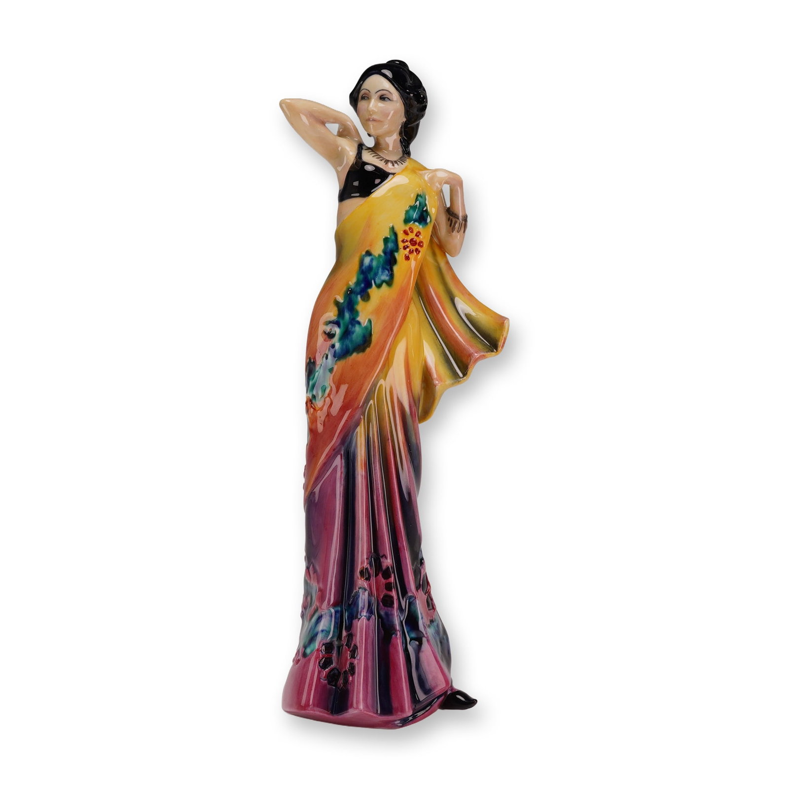 Royal Doulton Prototype Figurine, Eastern Grace HN3683: The figure depicts a woman in a traditional Indian sari in a standing pose with her right arm raised behind her head and her left hand grasping the fabric of her garment. She wears a black sleeveless 
