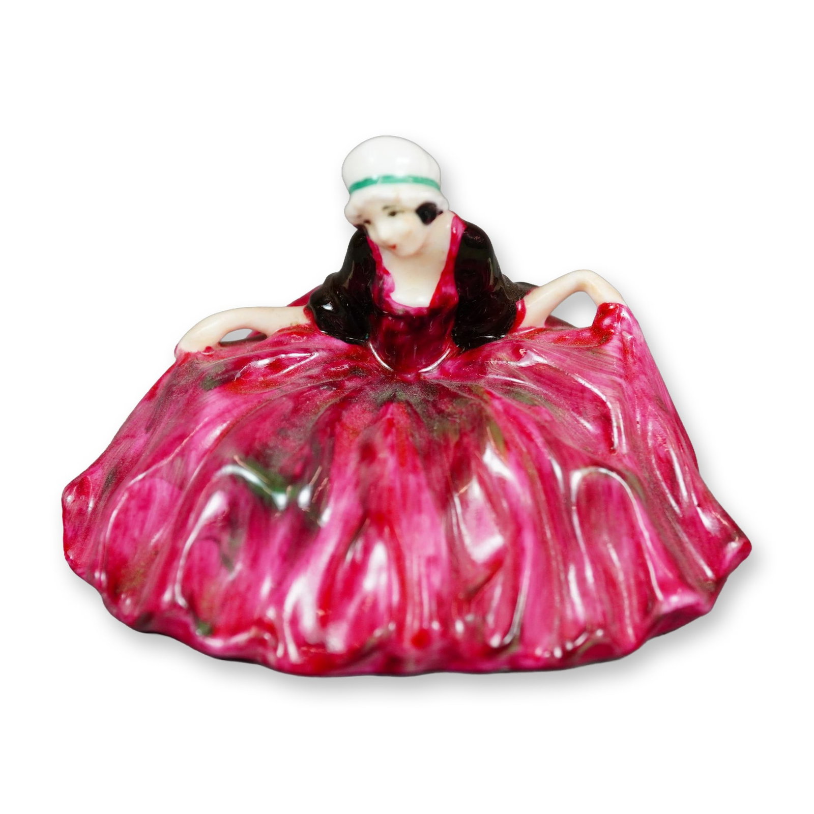 Royal Doulton Colorway Figurine, Polly Peachum: Character from "The Beggar's Opera", the figure depicts a young woman curtsying. She is shown wearing pink gown with green accents. Royal Doulton backstamp. Dimensions: 3"L x 2.5"W x 2.25"H Manufactur