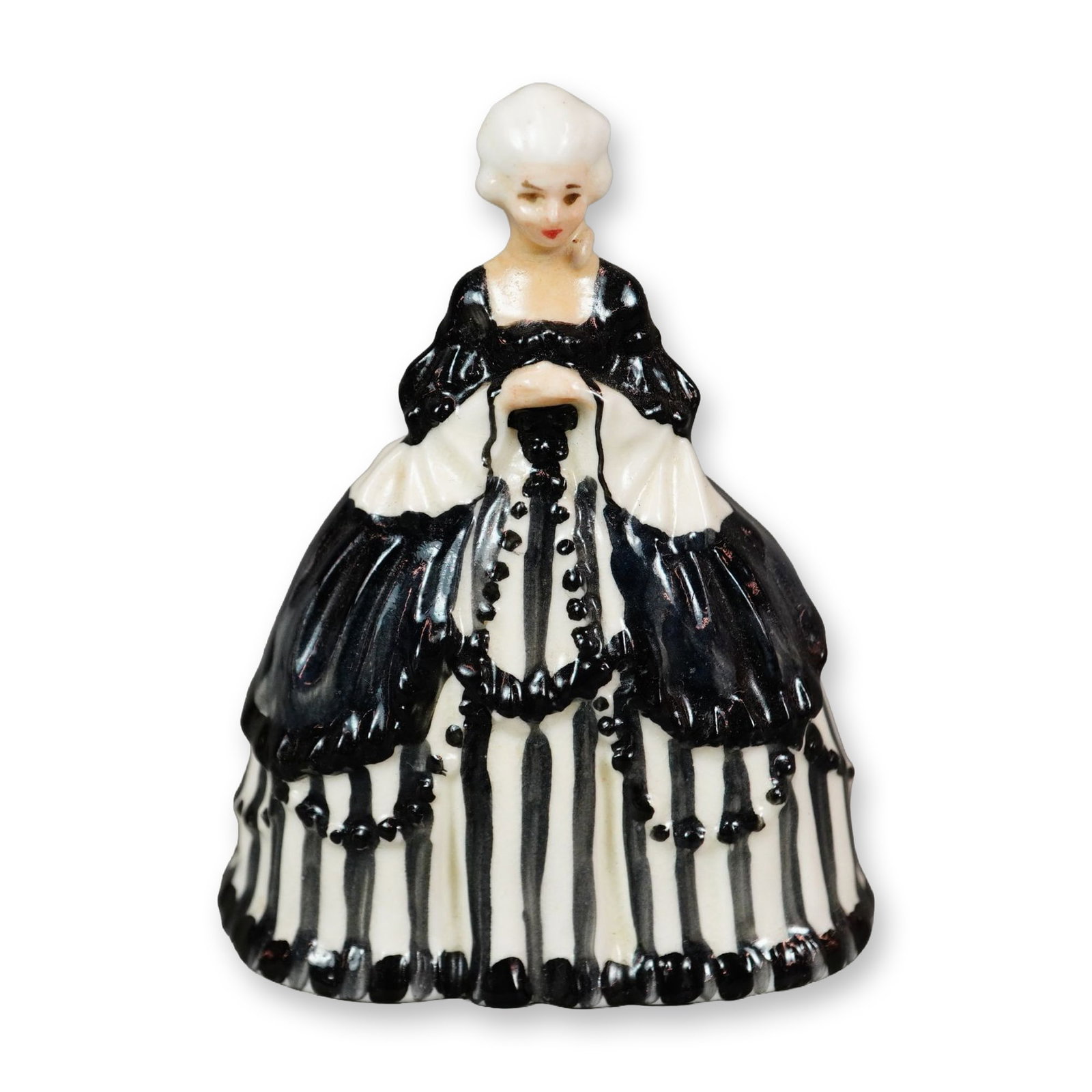 Royal Doulton Figurine, Crinoline Lady HN653: Hand painted figure of a woman in a black and white gown. Royal Doulton backstamp. Dimensions: 2.25"L x 1.5"W x 2.75"H Manufacturer or Brand: Royal Doulton Country of Origin: England Weight: 45 grams