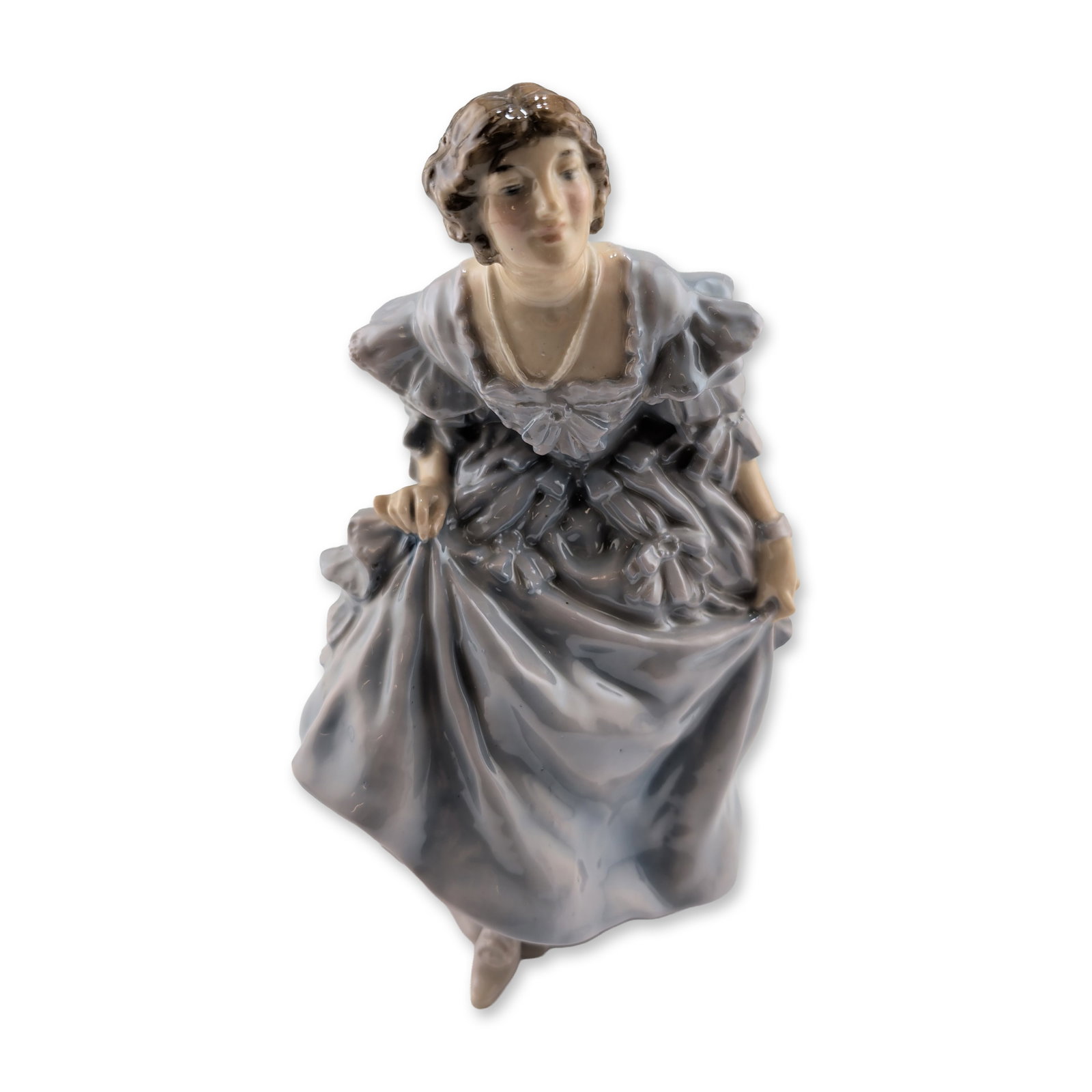 Royal Doulton Porcelain Figurine, Curtsey HN57: Hand-painted glazed porcelain figurine titled "The Curtsey," designed by E.W. Light. The figure is depicted in a voluminous, multi-tiered gown with ruffled detailing, finished in a tonal gray and blue