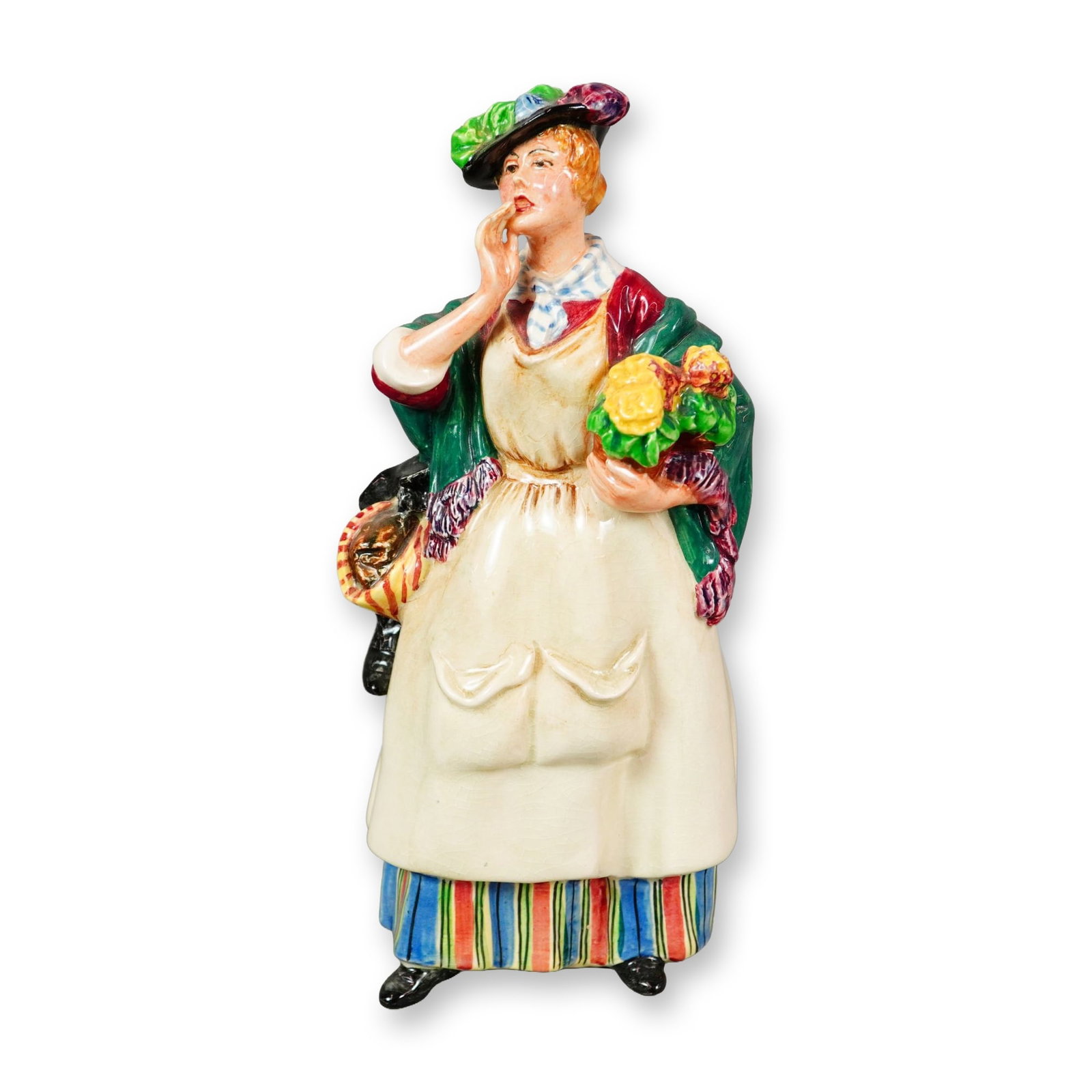 Royal Doulton Porcelain Figurine, Odds and Ends HN1844: Part of the Street Vendor series, designed by Leslie Harradine. Hand-painted figurine depicting a woman selling bric-a-brac on the streets of Victorian London. The figure shows a flower seller wearing