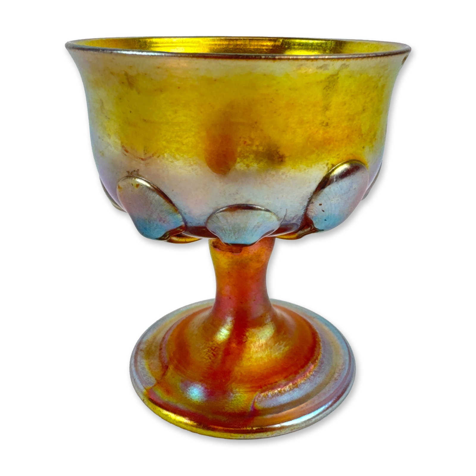 Louis Comfort Tiffany Studios Favrile Glass Footed Dish: In golden Favrile glass, featuring a flared rim and applied pulled-leaf decorations. The hand-blown vessel is supported by a short tapering stem on a circular domed foot, showing multi-colored iridesc