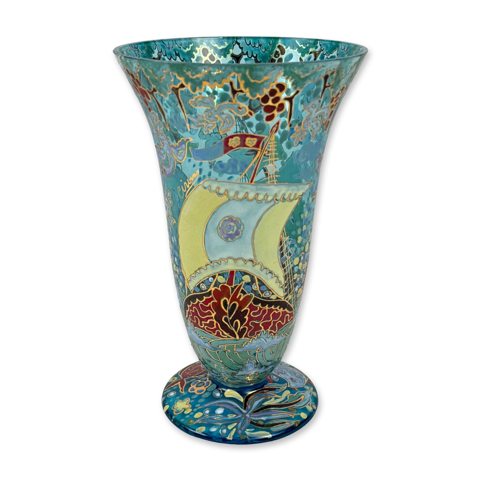 Genis Cirera Casanova Enameled Glass Trumpet Vase: Genis Cirera Casanova footed trumpet-form glass vase in translucent blue, featuring raised cloisonne-style enamel decoration with a maritime theme. The wrap-around composition depicts sailing galleons