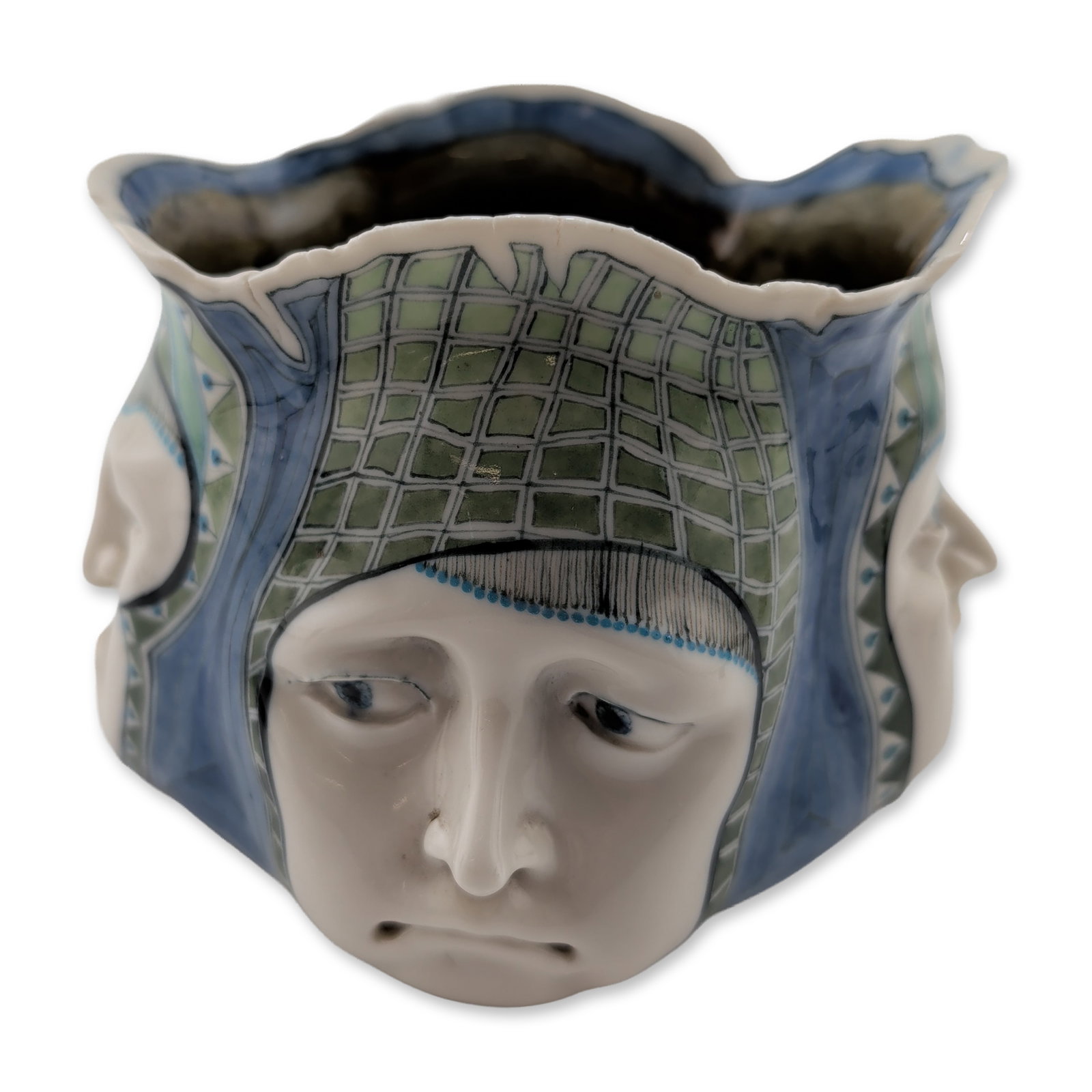 David Burnham Smith Very Rare Four-Face Vase: Contemporary relief of four face vessel in glazed white ceramic, featuring a quadrangular form and scalloped rim. The body is molded with four high-relief human faces with various expressions, accente