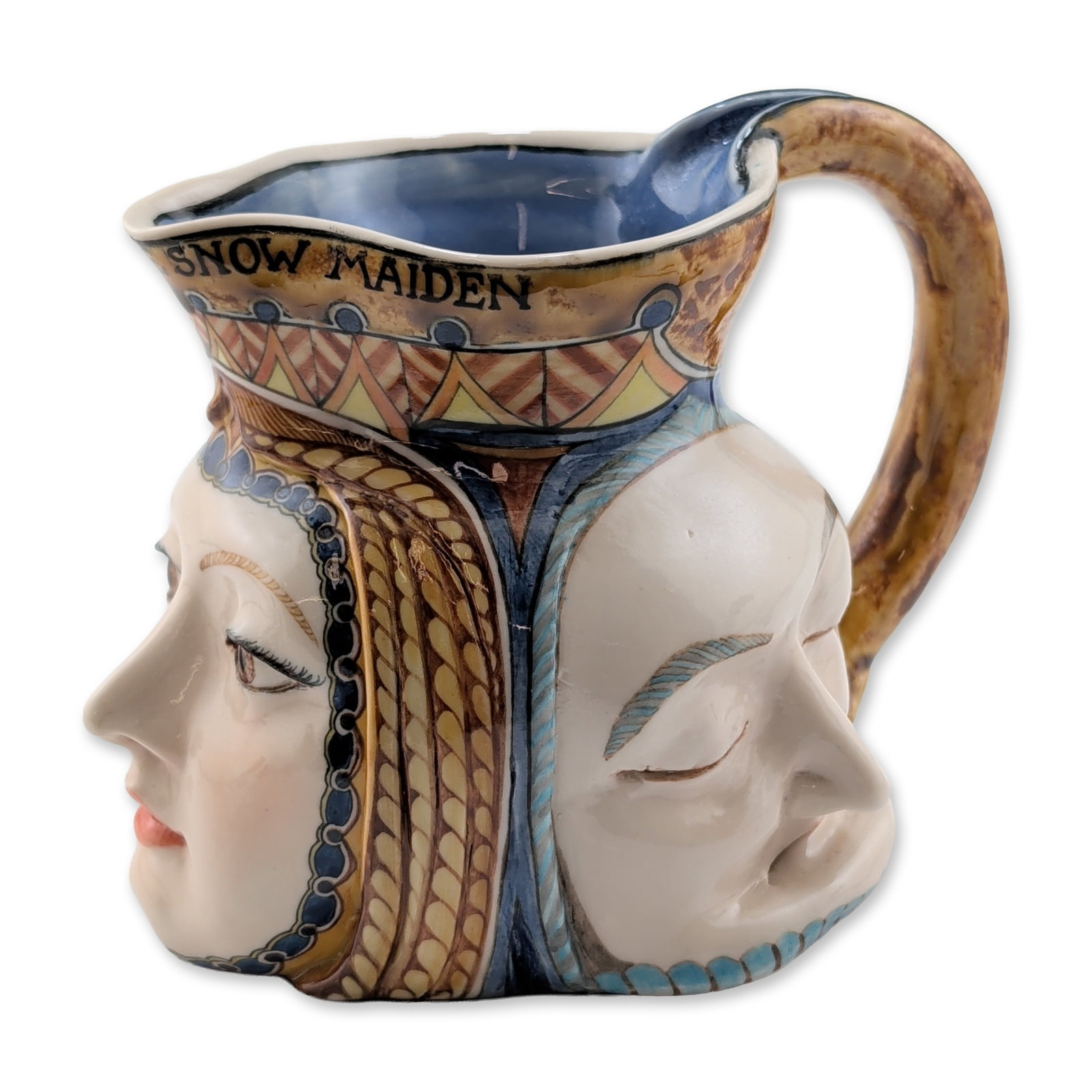 David Burnham Smith Very Rare Ceramic Three-Face Mug, Dreaming of the Snow Maiden: A ceramic character jug with three distinct faces and expressions. The piece features stylized geometric and braided headgear patterns rendered with tube-lined decoration. The interior is finished in 