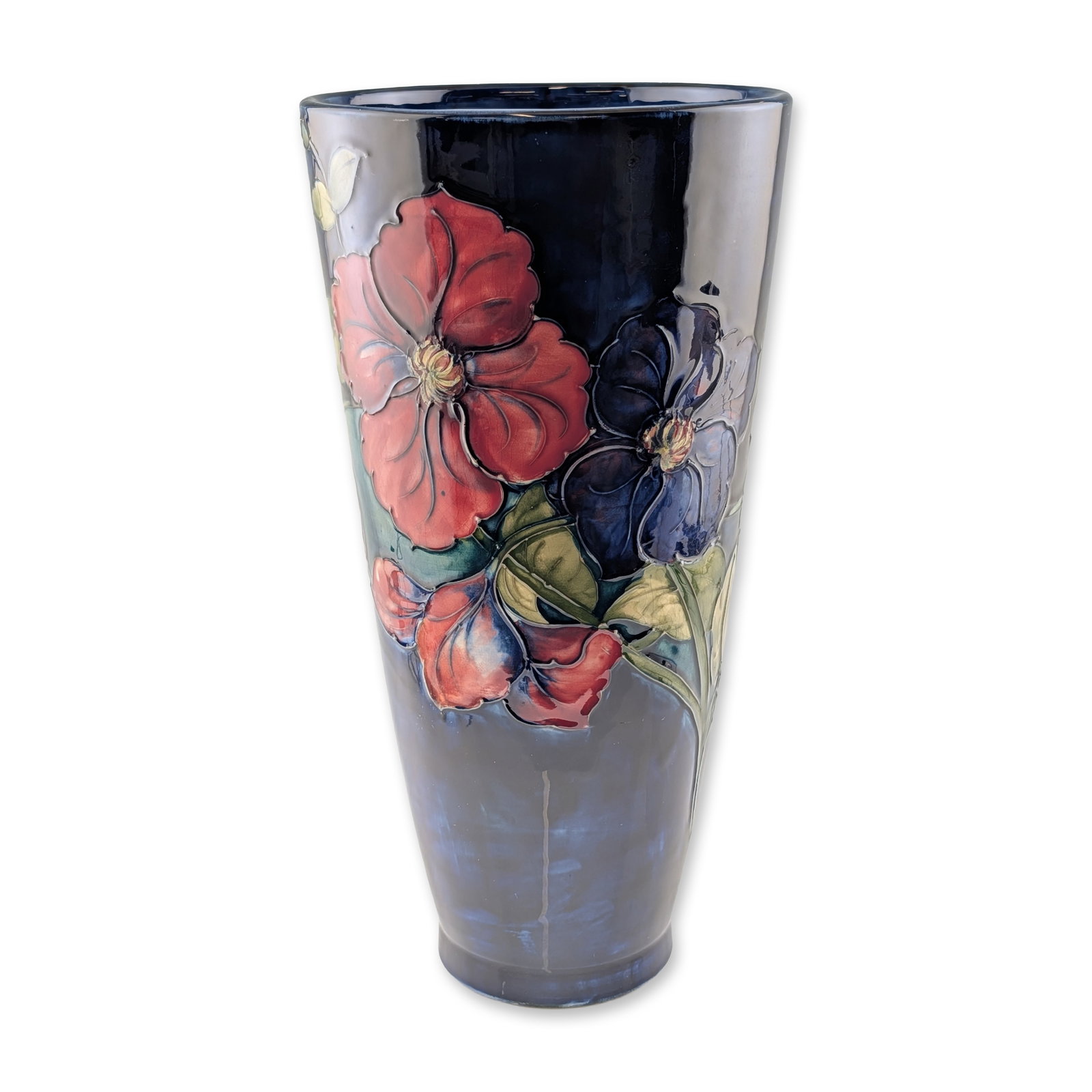 Moorcroft Pottery Large Vase, Anemone: A large tapered conical earthenware vase in the Anemone pattern, featuring hand-painted tube-lined floral motifs. The decoration depicts large blossoms in shades of red and deep purple set against a d