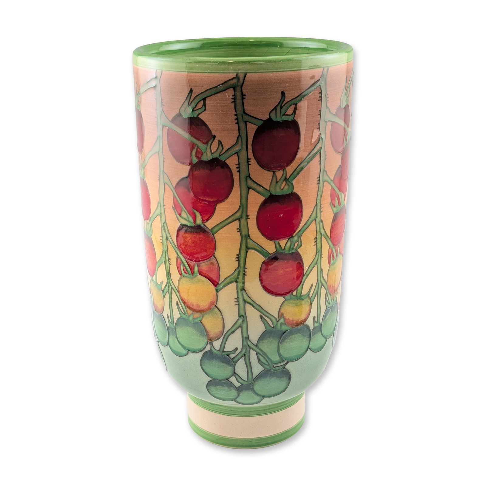 Dennis Chinaworks by Sally Tuffin Cherry Tomato Vase: The cylindrical form features a flared rim and stepped foot, decorated with a hand-painted and tube-lined cherry tomato vine motif. The design depicts fruit in progressive stages of ripeness from gree