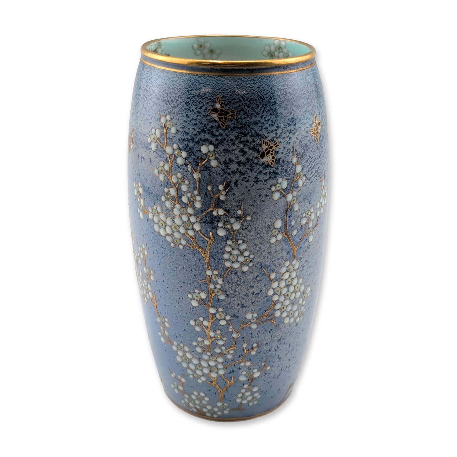 Royal Doulton Japonisme Powder Blue Porcelain Vase: A barrel form featuring a mottled powder blue ground. The exterior is decorated with trailing flowering branches in raised white and pale blue enamels, detailed with fine gilding and accented by flyin