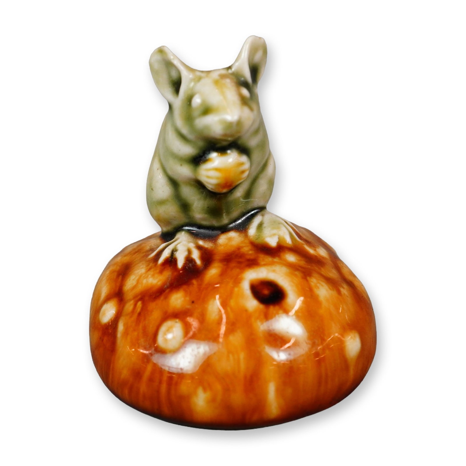 Doulton Lambeth by George Tinworth Stoneware Figurine, Currant Bun: Stoneware figure of a charming light grey mouse, shown seated on a bun and enjoying a currant. Marked with a GT impressed monogram and an impressed Royal Doulton rosette stamp. Artist: George Tinworth
