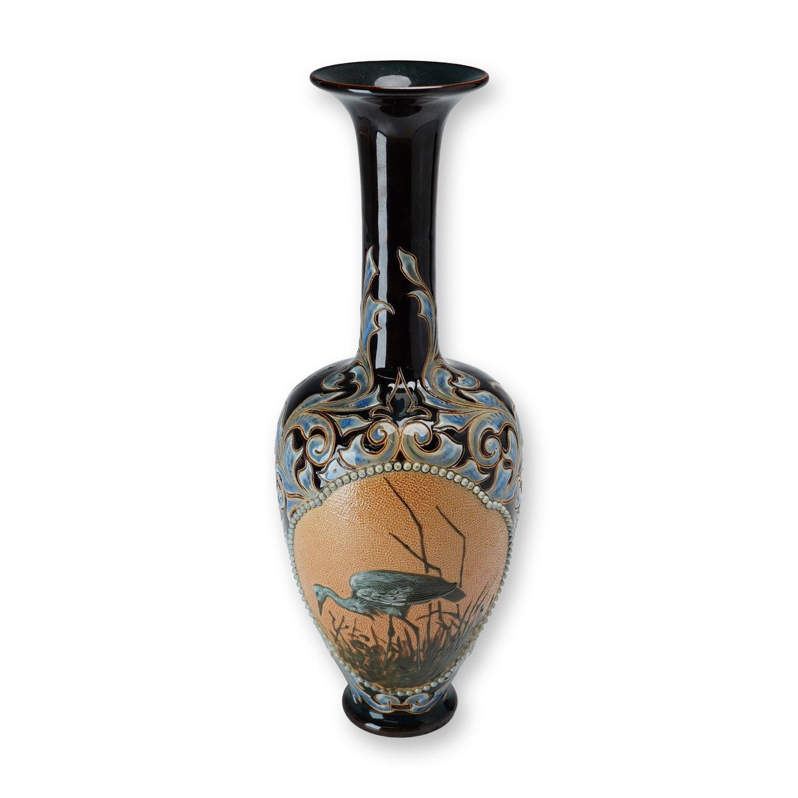 Doulton Lambeth by Florence Barlow and Frank Butler Stoneware Art Nouveau Bird Motif Vase: A stoneware vase in brown, blue, and white glazes. The main panel features a pate-sur-pate stork designed by Florence Barlow. The panel is framed by a white beaded relief border and an incised Art Nou