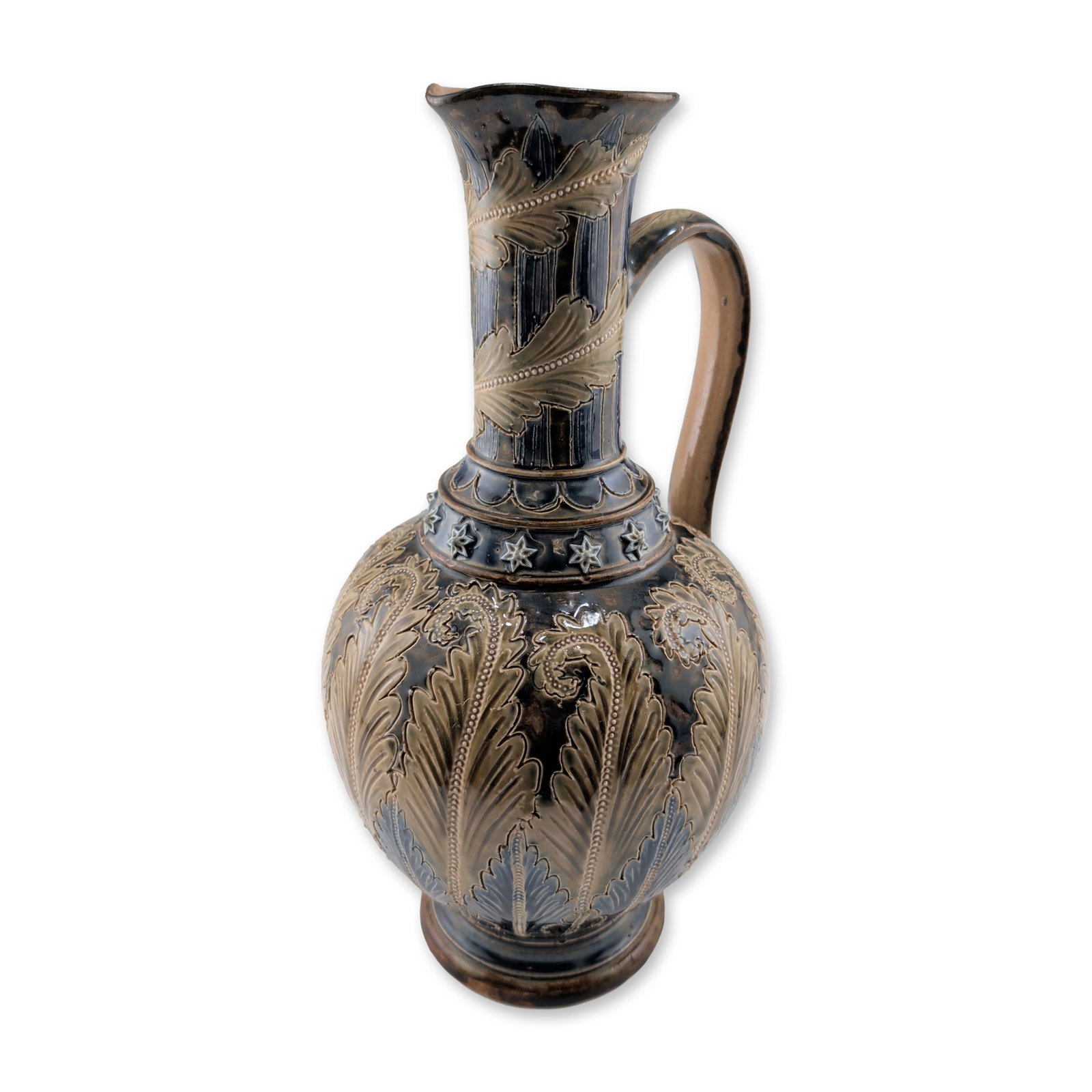 Doulton Lambeth Stoneware Art Nouveau Foliate Motif Ewer: Featuring sgraffito and sprigged relief decoration with acanthus and fern-like foliage. The bulbous body displays buff-colored leaves against a deep cobalt and mottled brown ground, with a central ban
