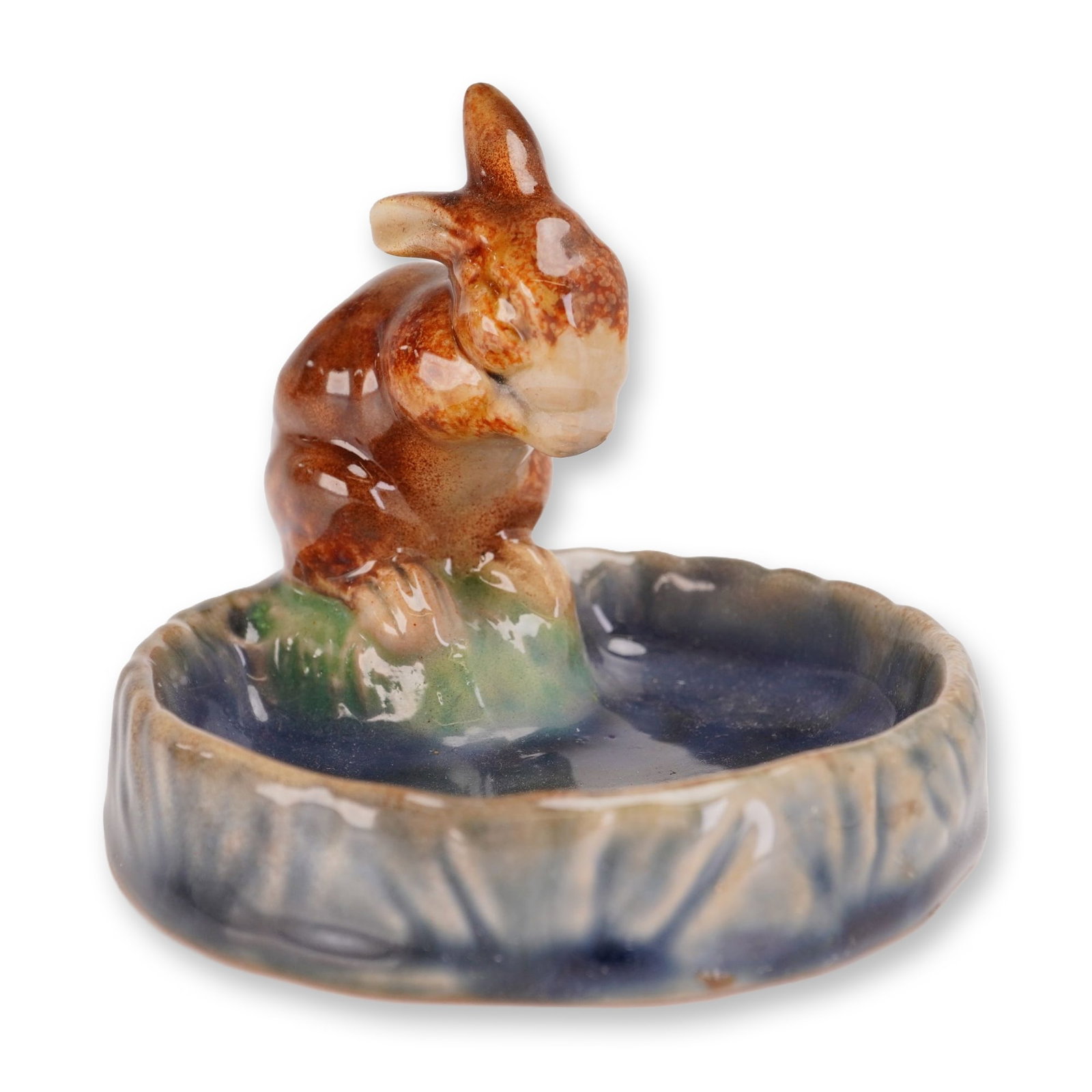 Royal Doulton Lambeth by Harry Simeon Stoneware Brown Rabbit Bibelot: Doulton Lambeth English art pottery tray designed by Harry Simeon. The circular form features a figural rabbit perched on the rim, peering into a shallow basin. Finished in a multi-colored high-gloss 