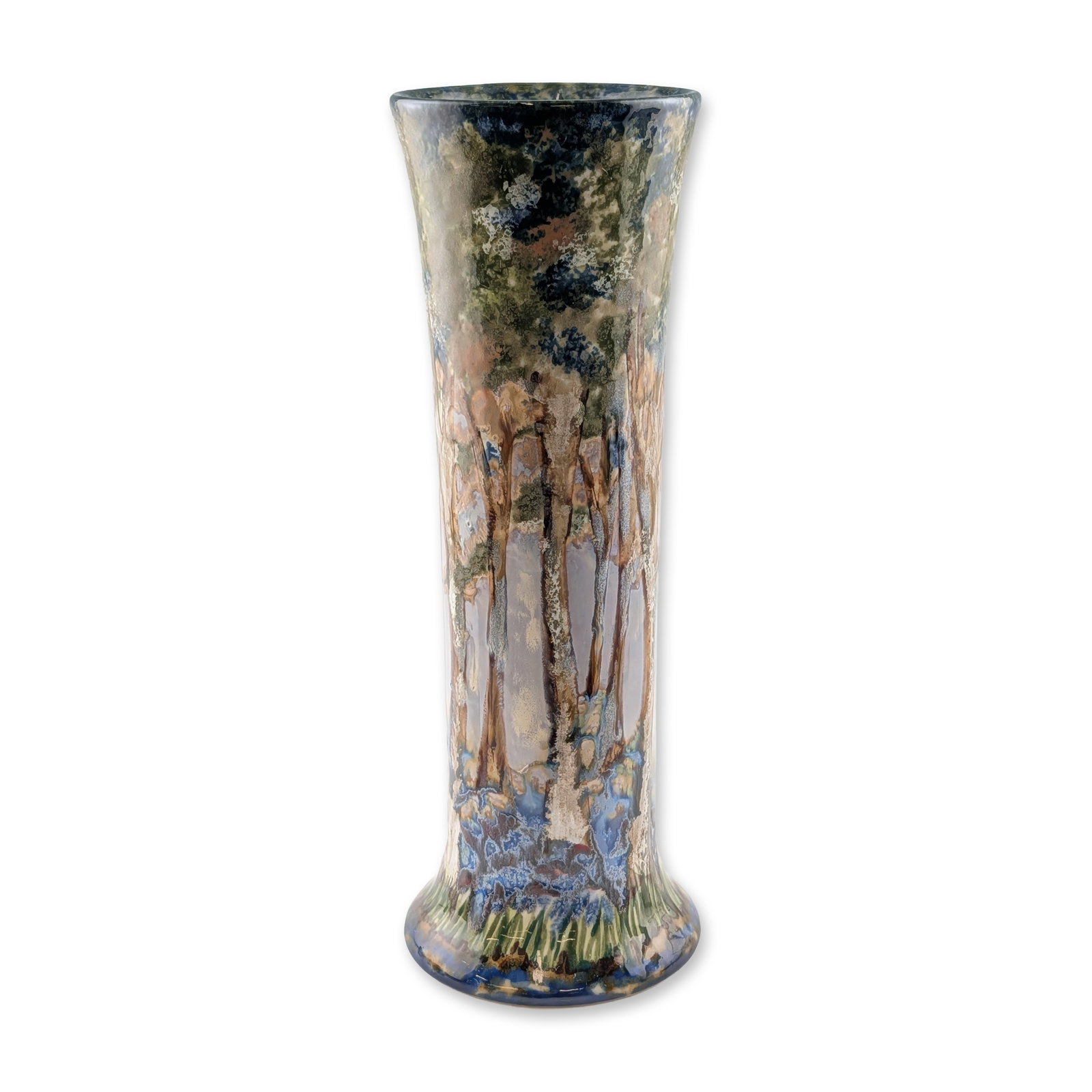 Cobridge Stoneware Forest Scene Trial Vase: Tall cylindrical-shaped stoneware vase featuring a hand-decorated continuous woodland landscape. The design depicts slender tree trunks amidst a leafy canopy with a dense carpet of bluebells in the fo