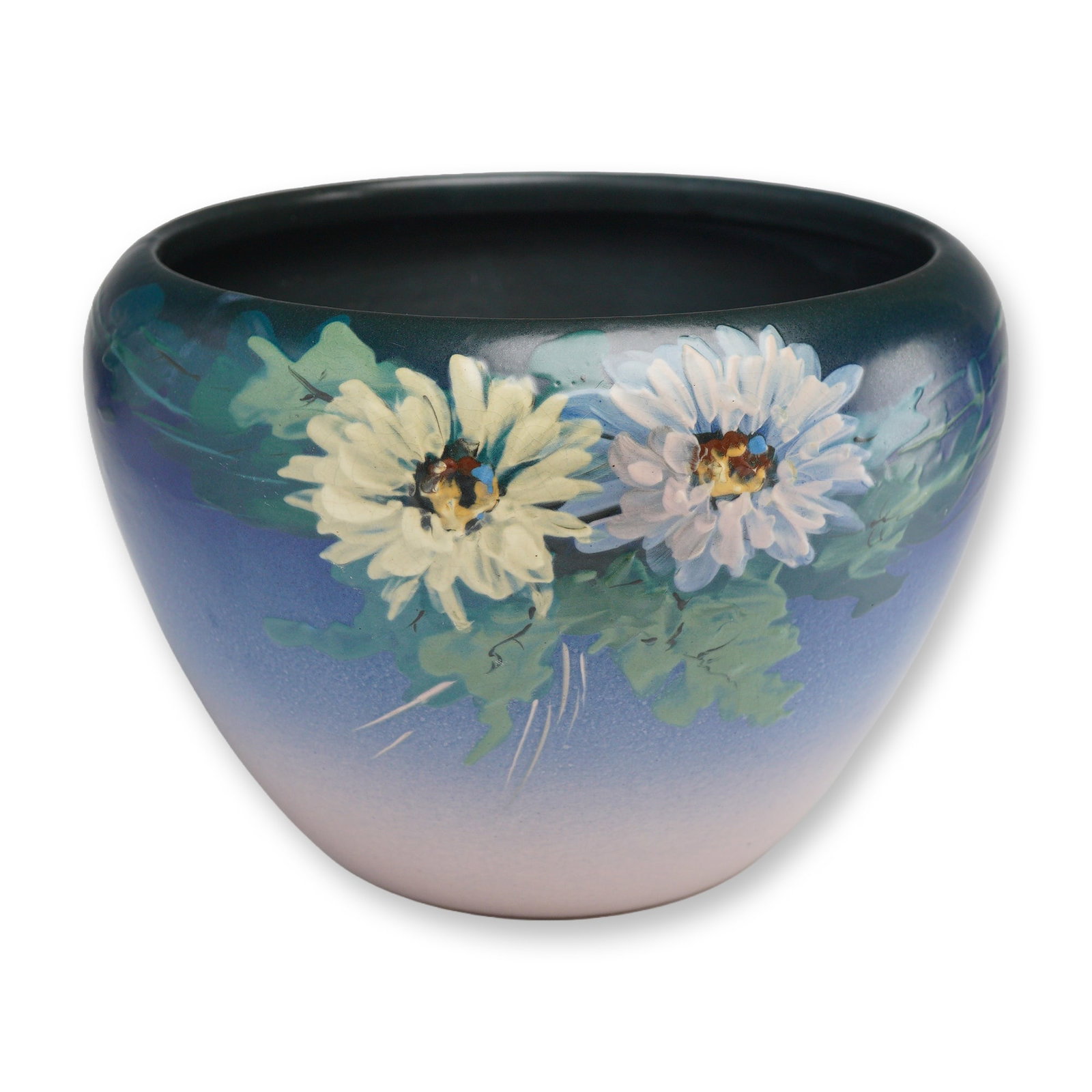 Weller Pottery Hudson Two-Toned Floral Jardiniere: A Weller Pottery Hudson jardiniere featuring a classic globular form and a signature matte glaze. The vessel displays a masterful two-toned ombre transition, fading from a deep dark blue rim through s