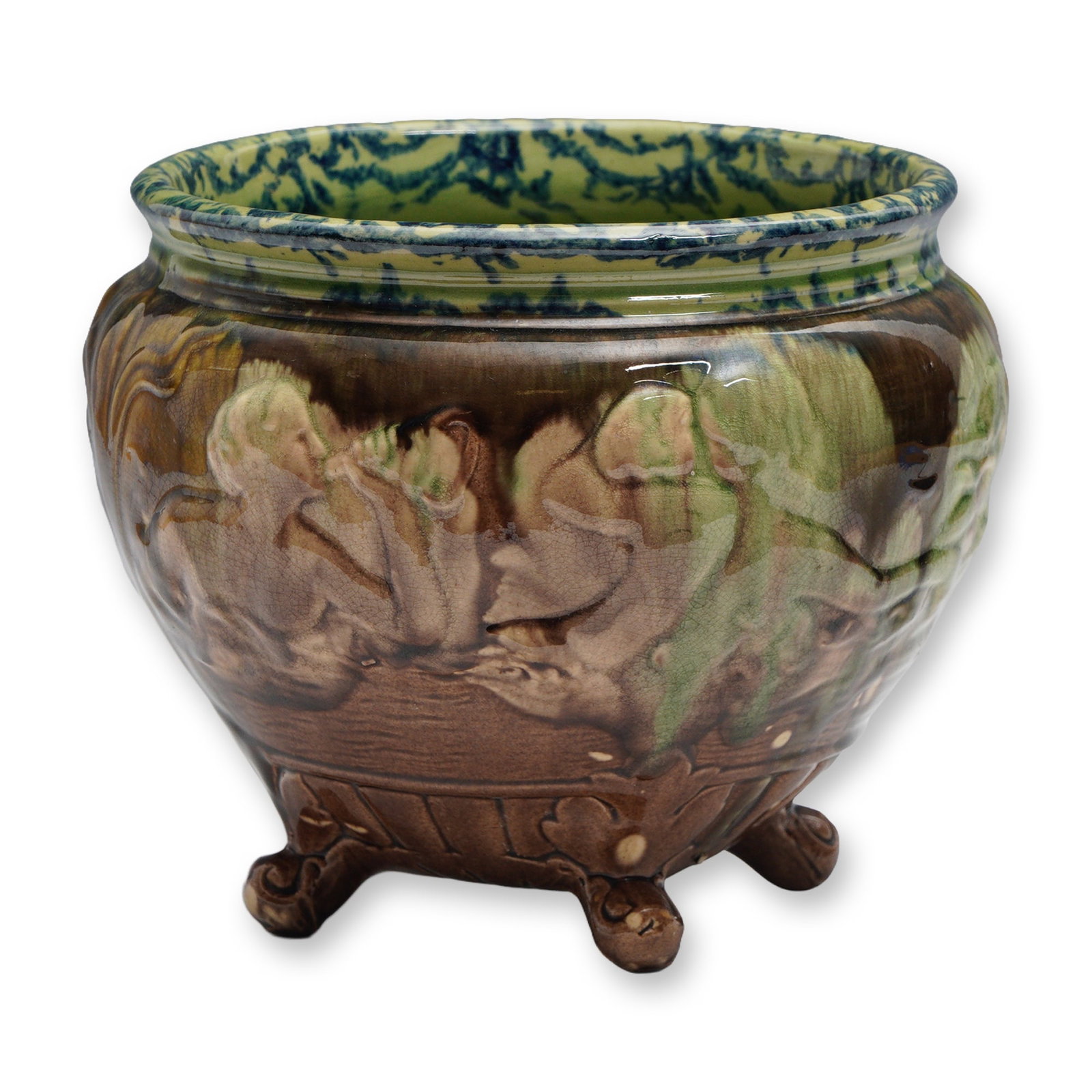 Weller Pottery Water Nymph Footed Jardiniere: Weller Pottery Water Nymph jardiniere, finished in a rich majolica-style glaze. This Art Nouveau piece features beautifully detailed relief-molded figures of water nymphs in flowing, organic forms enc