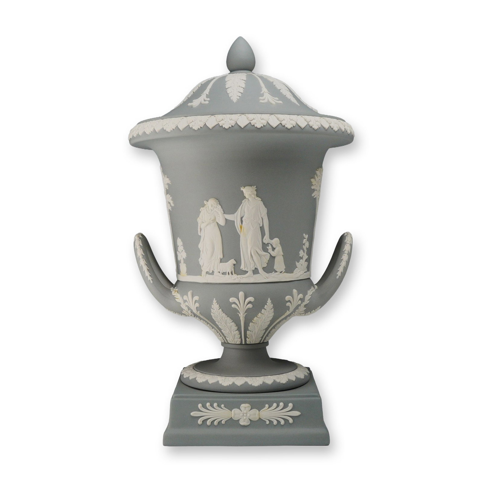 Wedgwood Gray Jasperware Lidded Campagna Urn: This Wedgwood lidded pedestal urn is crafted in gray jasperware with white sprigged bas-relief decoration. The vessel is of bolted construction, featuring a classic Campagna form with twin handles, a 