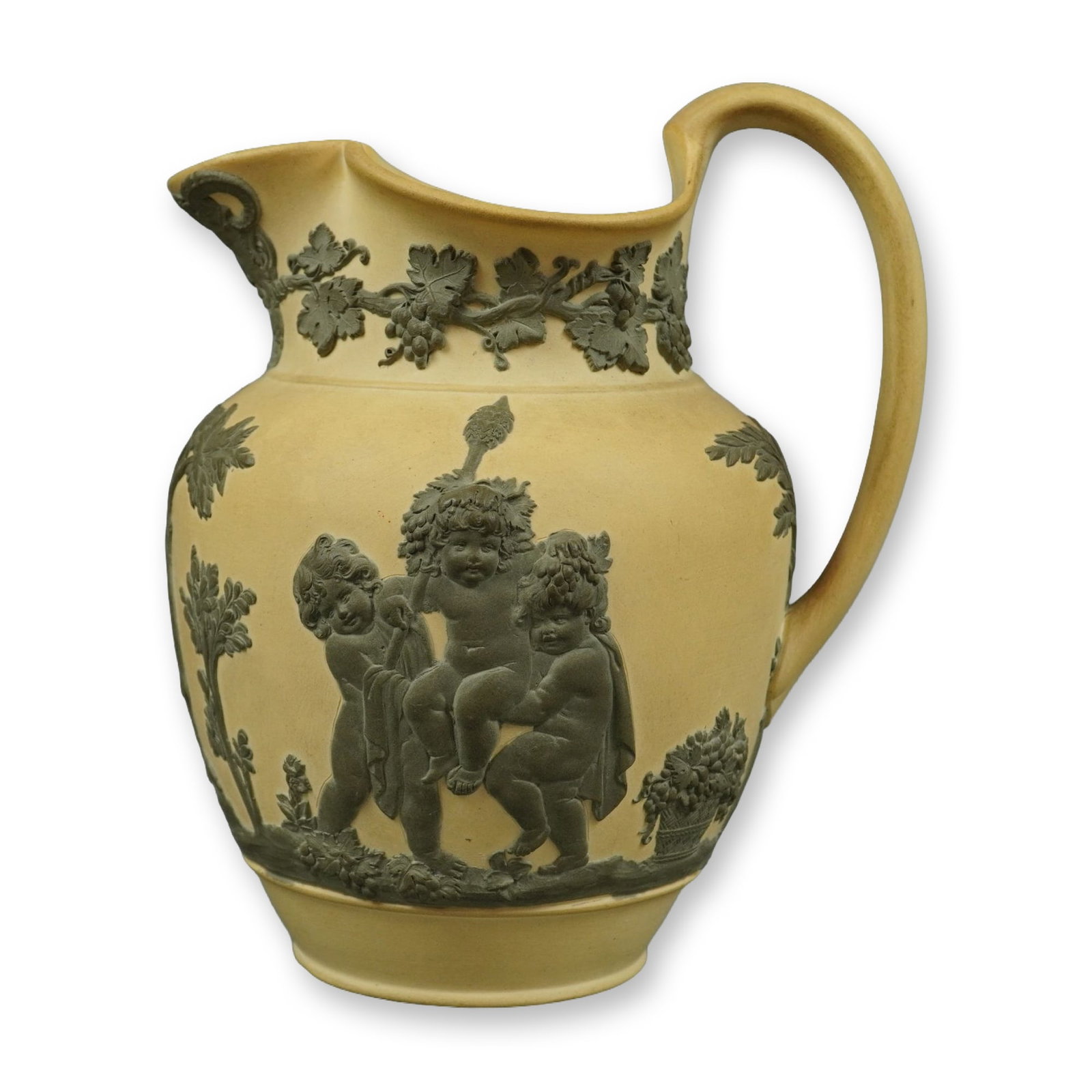 Wedgwood Primrose and Sage Green Jasperware Bacchanalian Boys Pitcher: This Wedgwood jasperware pitcher is crafted from fine-grained unglazed stoneware in a primrose yellow color with applied bas-relief sprigged decoration in a contrasting sage green. The central decorat