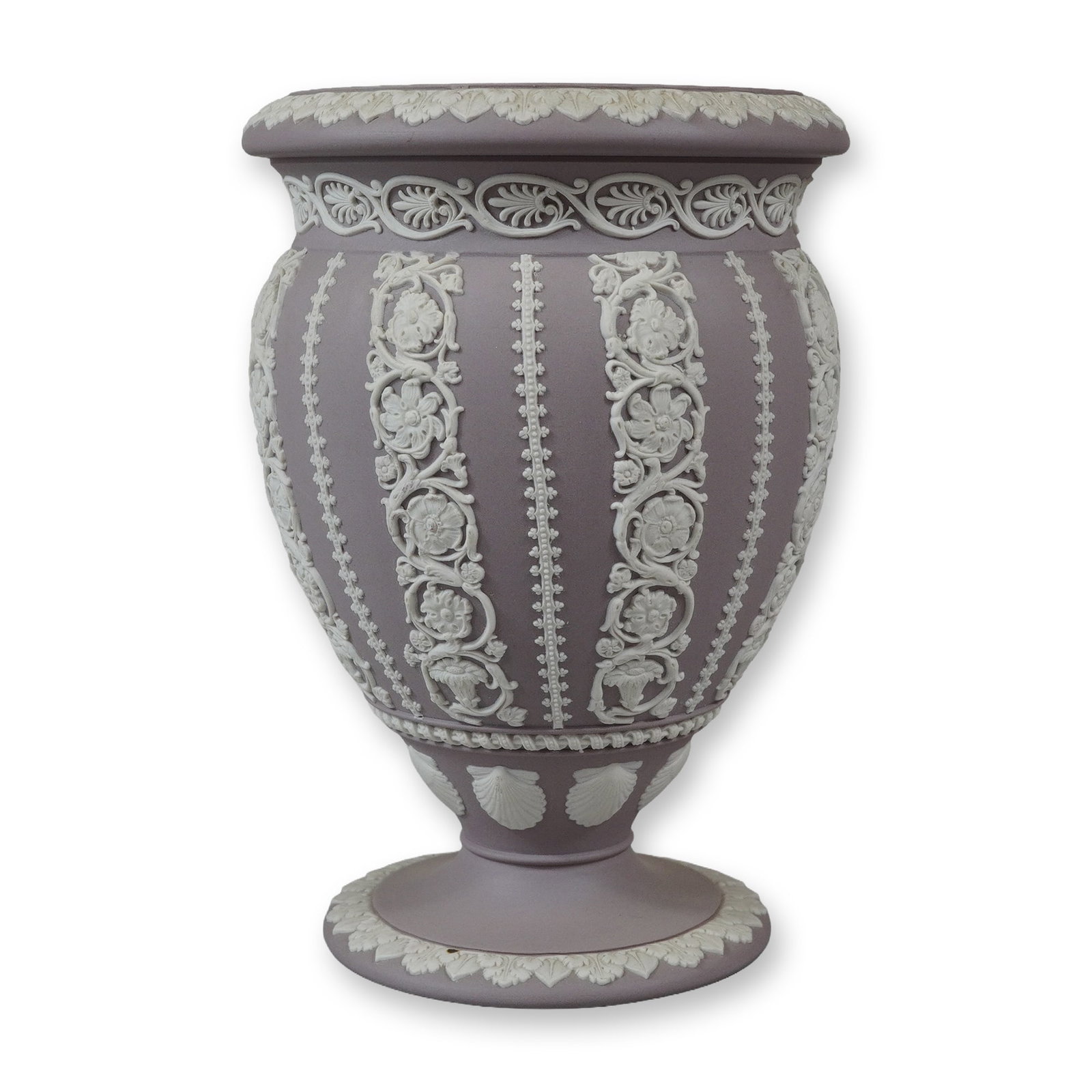 Wedgwood Lilac Jasperware Floral Swag Pedestal Vase: This lilac jasperware pedestal vase is a product of Wedgwood, England, featuring the company's signature matte-finish stoneware. The body is rendered in a soft lilac or lavender color, embellished wit