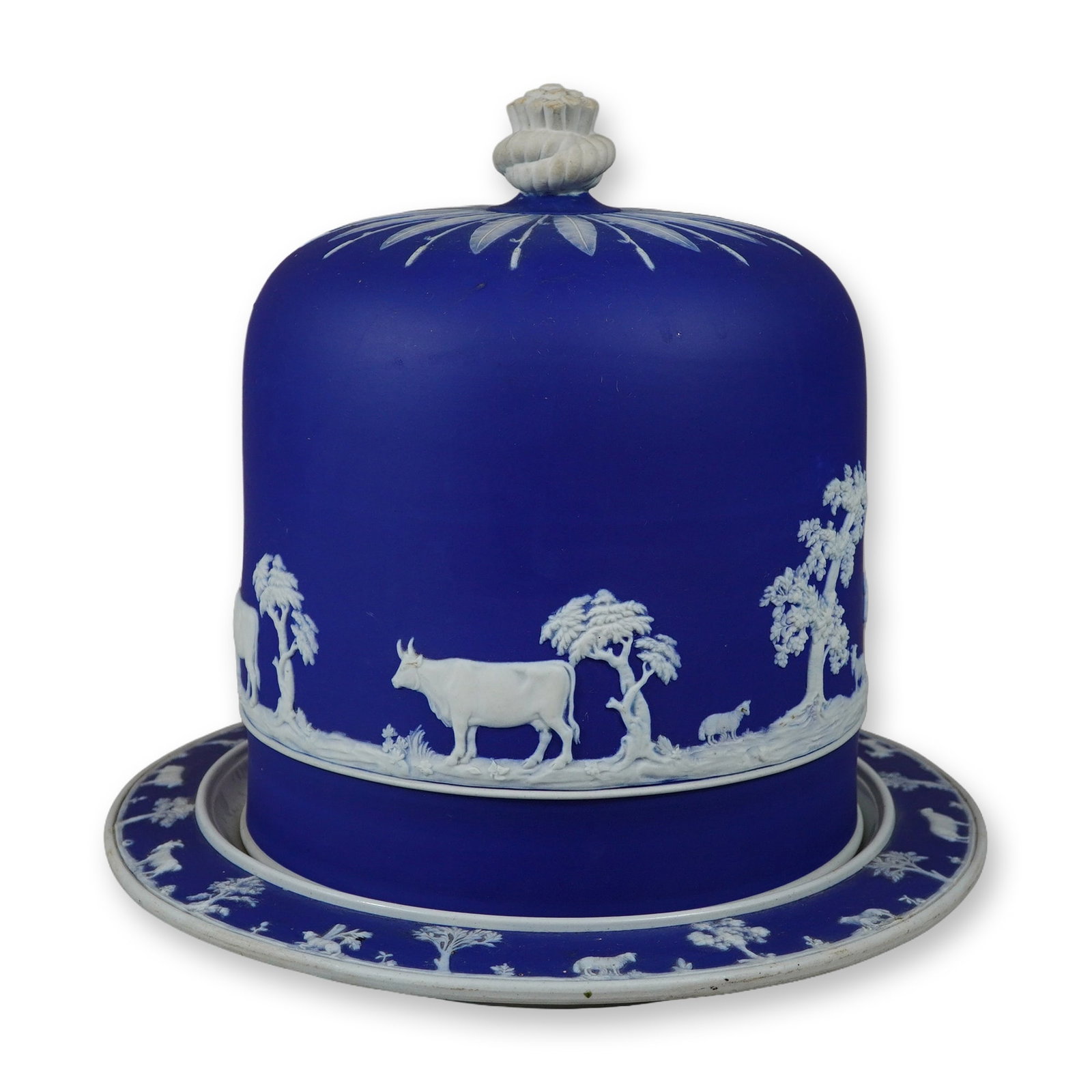 Wedgwood Blue and White Jasperware Stilton Cheese Dish and Cover: A two-piece stoneware Stilton cheese dome and matching underplate in blue and white jasperware. The set consists of a large bell-shaped cover and a circular underplate. The dome features a deep cobalt
