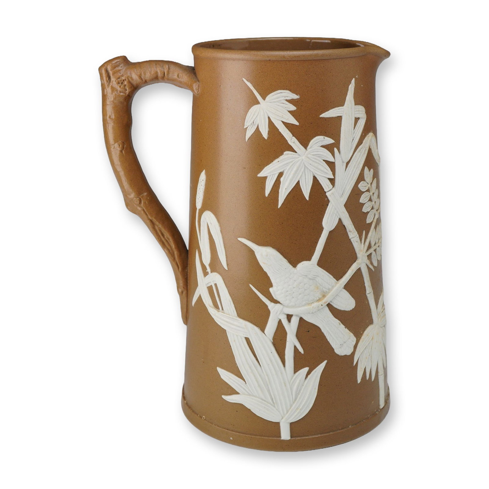 Dudson English Jasperware Jug: This late 19th-century English stoneware jug, produced by Dudson Brothers Ltd. of Hanley, Staffordshire, features a brown dry-bodied exterior with white sprigged relief decoration. The piece is decora