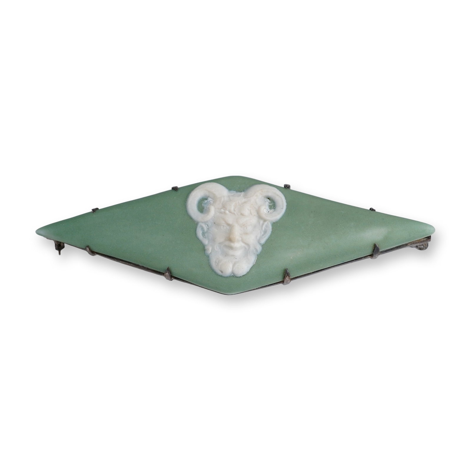 Wedgwood Green Jasperware Satyr Brooch in Silver Plated Frame, circa 1870: This Victorian-era bar brooch features an elongated lozenge or marquise-shaped sage green jasperware plaque manufactured by Wedgwood. The central motif is a white bas-relief cameo of a satyr or Pan he