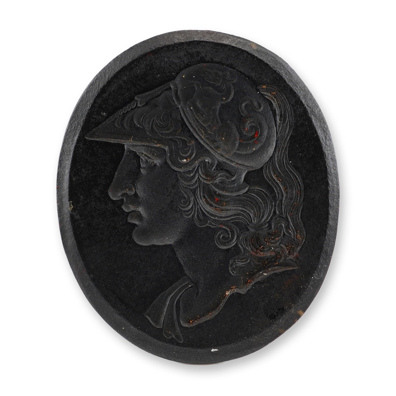 Wedgwood Black Basalt Medallion of Minerva: This oval relief-molded medallion is crafted from black basalt stoneware, a fine-grained, unglazed ceramic body developed by Josiah Wedgwood. The piece features a profile portrait of the goddess Miner