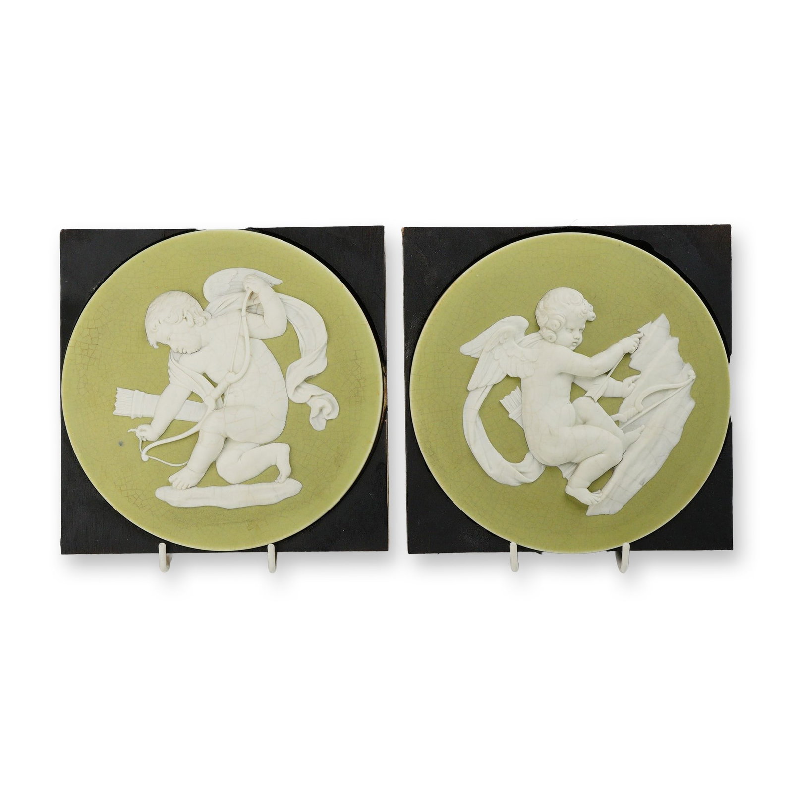 A Pair of Wedgwood Green and White Jasperware Round Plaques Depicting Cupids (1 of 3)