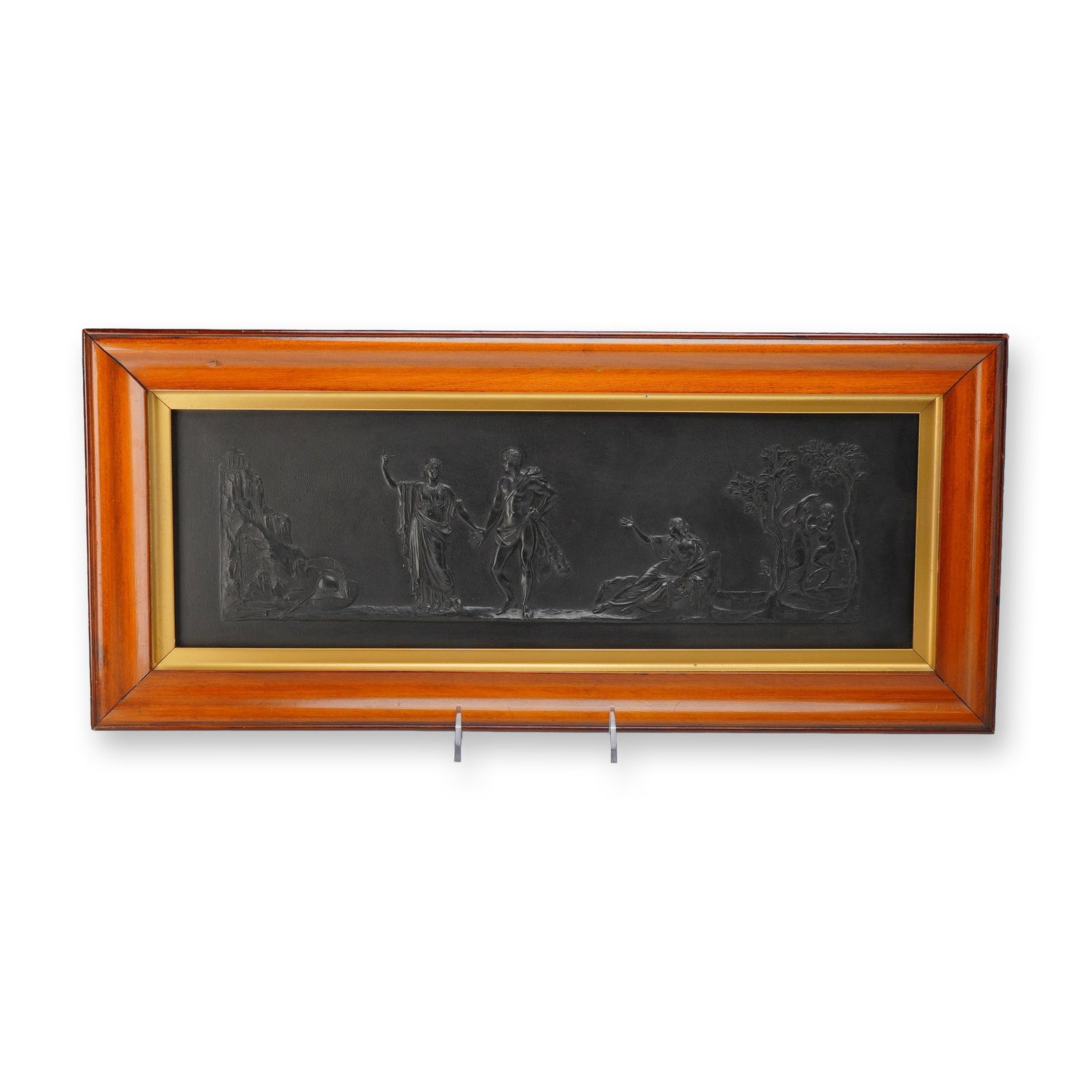 Wedgwood Black Basalt Stoneware Rectangular Plaque: This rectangular bas-relief plaque is crafted in black basalt stoneware, a material developed and popularized by Josiah Wedgwood. The relief features a continuous horizontal Neoclassical composition. 