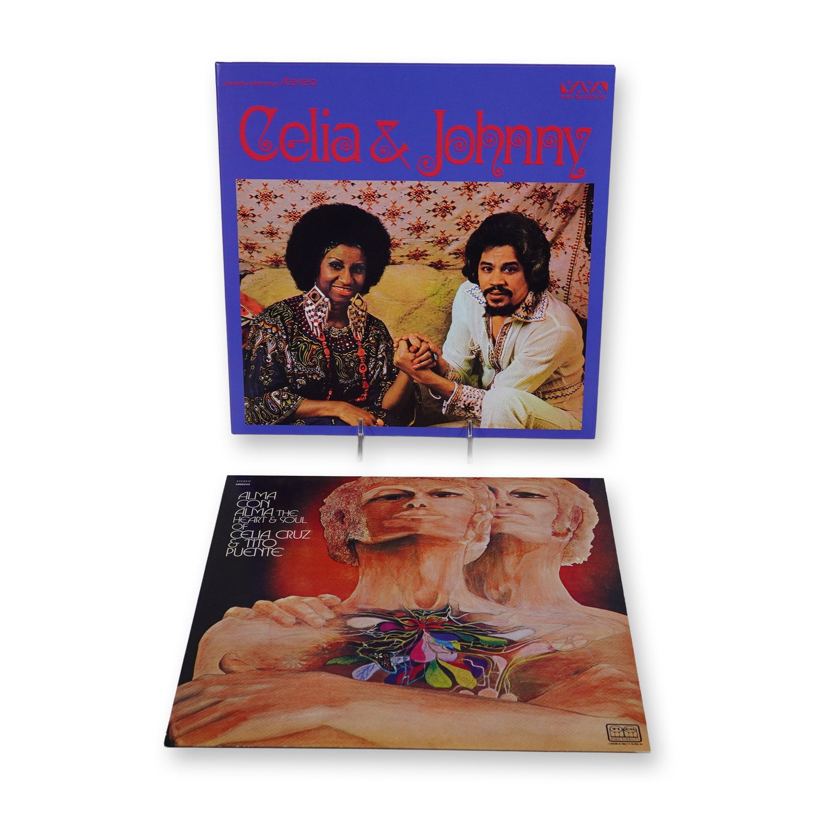 Two Celia Cruz Collaboration Vinyl LP Reissue Records: Two modern vinyl LP reissues featuring Celia Cruz in collaboration with Johnny Pacheco and Tito Puente. The first album, Celia and Johnny, was reissued by Craft Recordings in 2023 and includes a